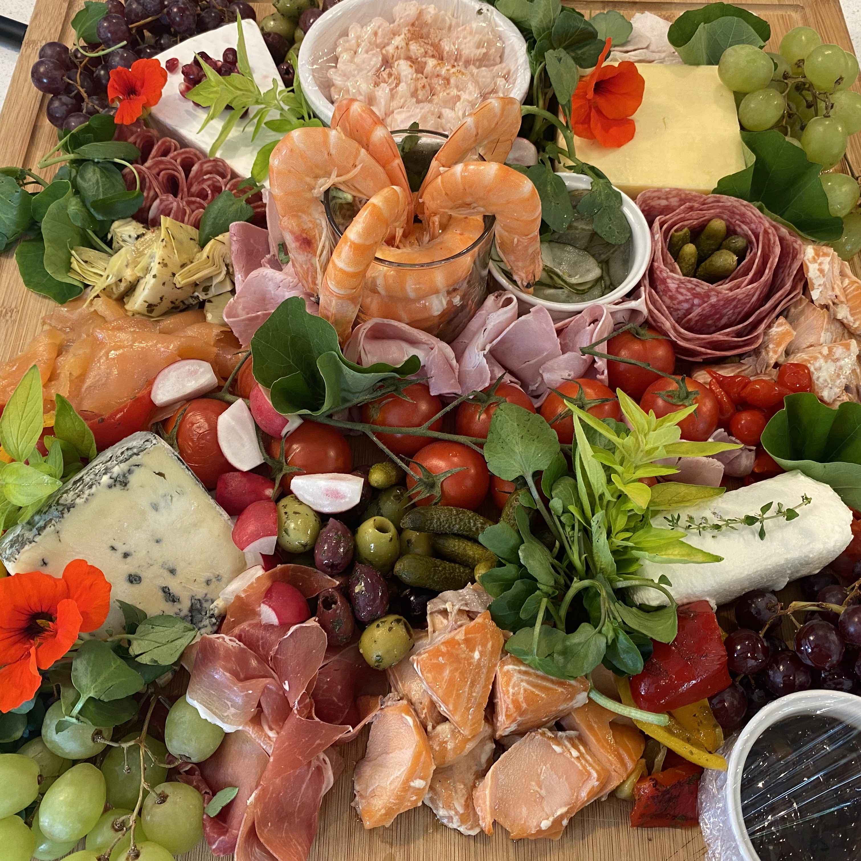 charcuterie Board with an arangement of meets and fruit