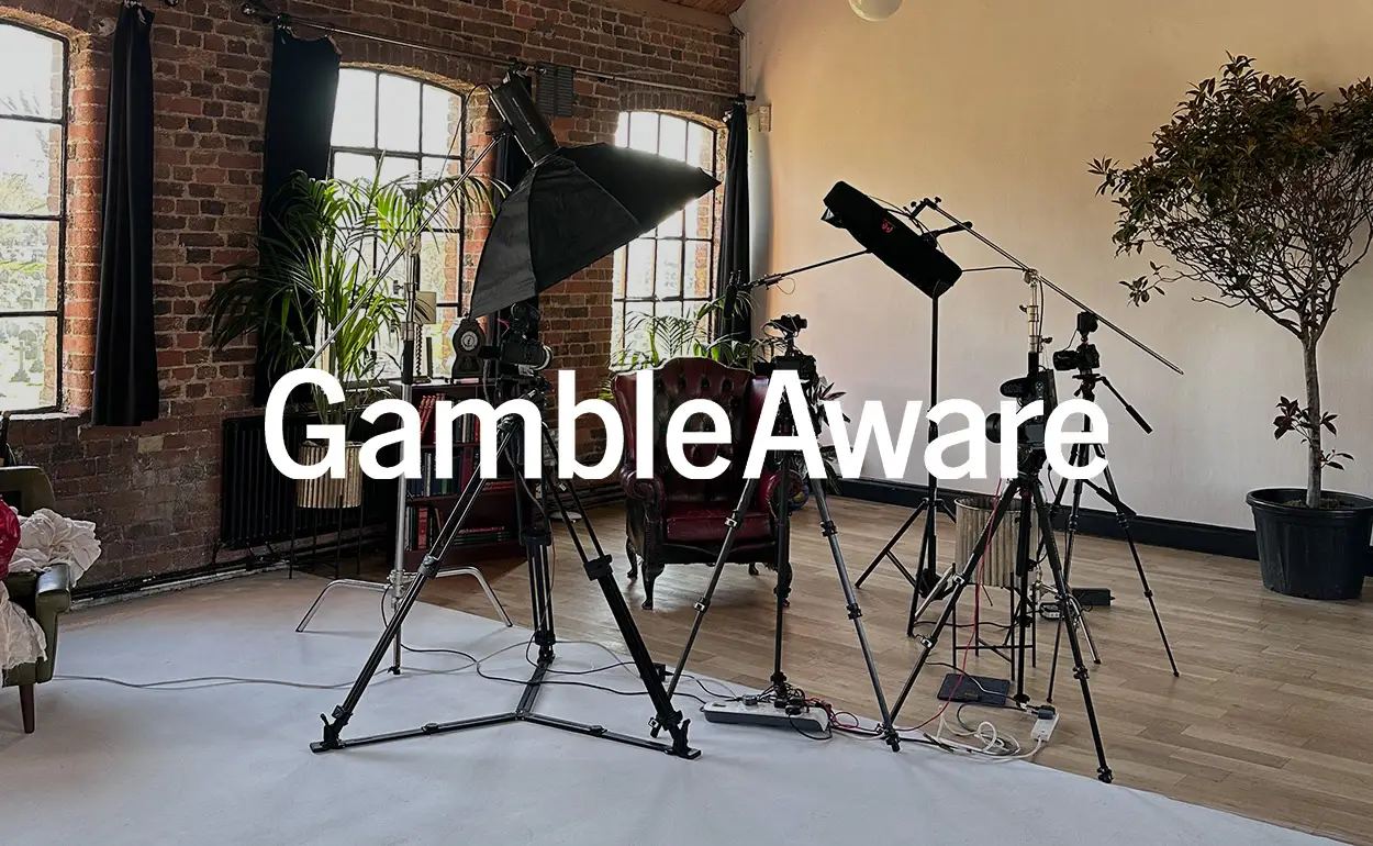 GambleAware logo overlay on professional video production studio setup for filming responsible gambling campaigns