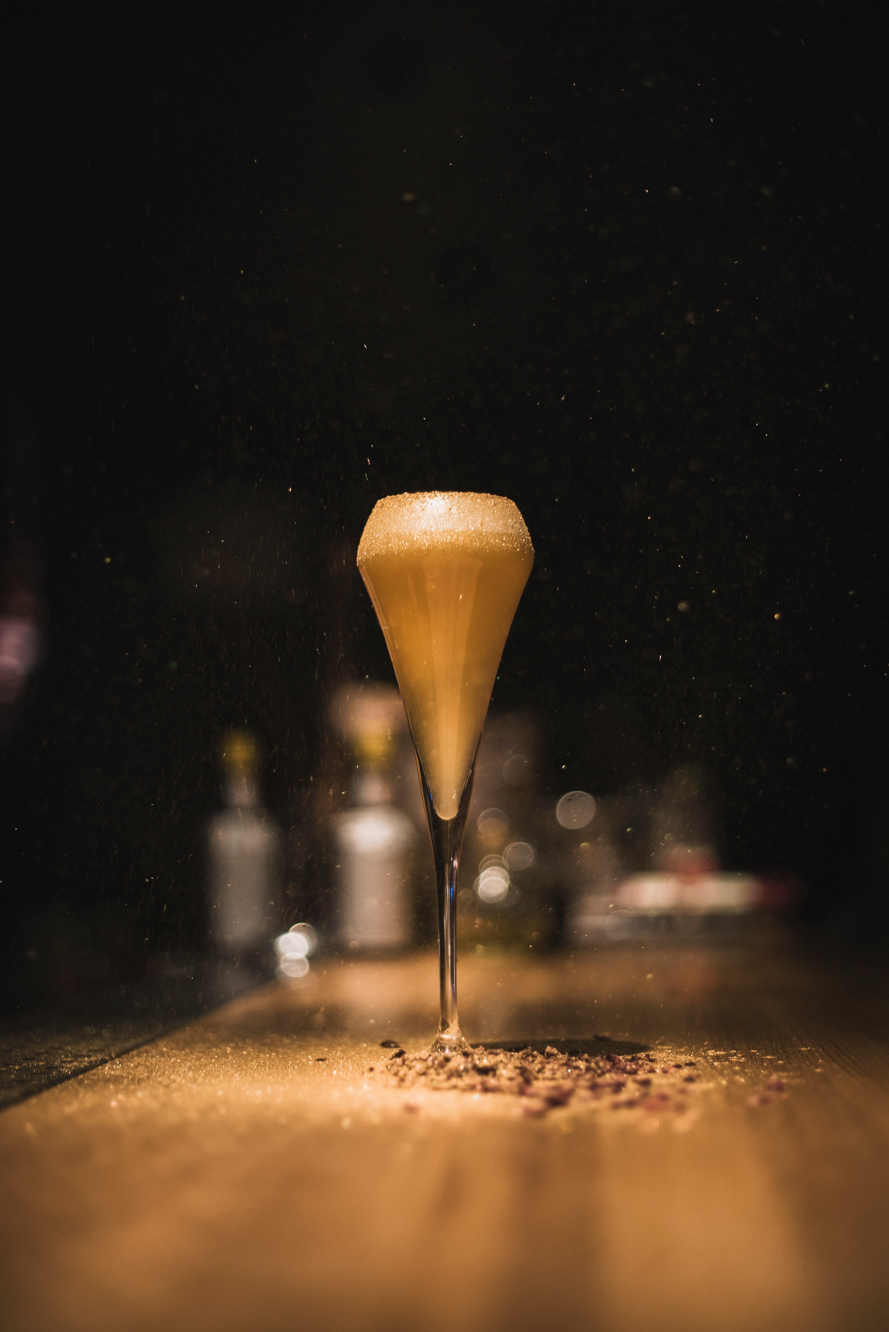 selective focus photography of clear champagne glass