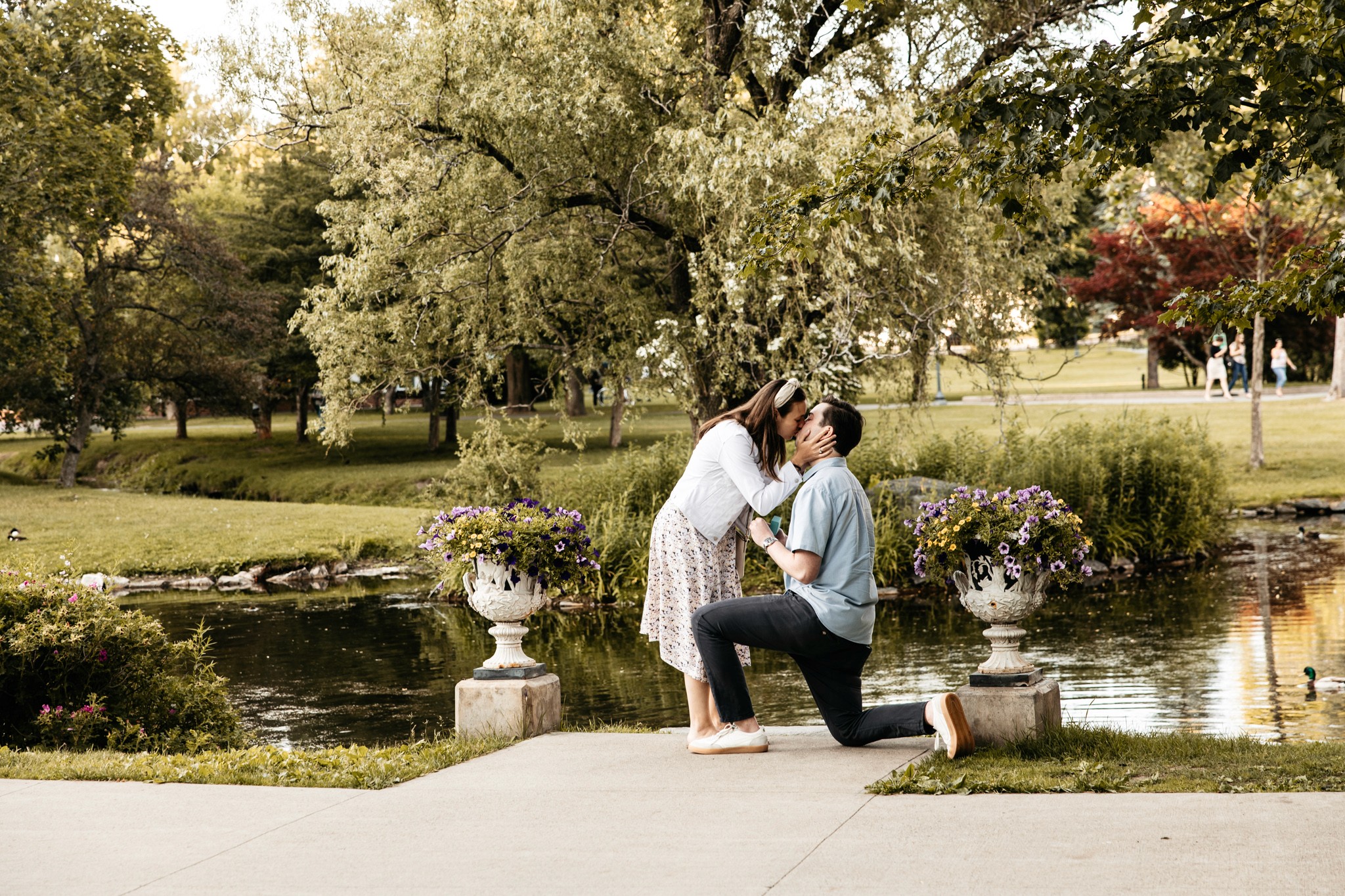 5:16 PMContent creator couple grinning from ear to ear, cheersing with hotdogs at the Mall in Central Park, NYC — fun, playful lifestyle and content creator photography by Lizz Spano Photography, New York City lifestyle photographer.