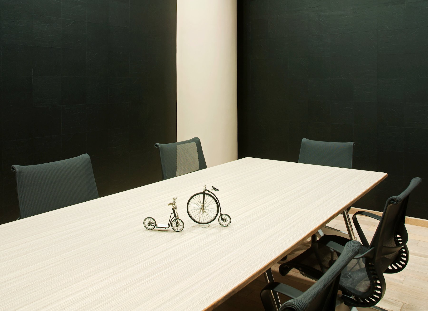 conference room table with dark walls