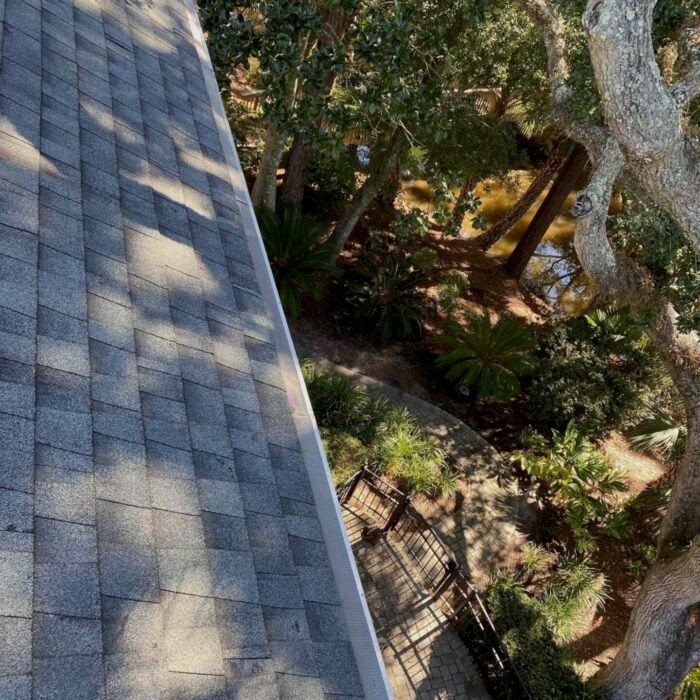 Before and after—gutter cleaned in Hilton Head SC, clear water flow restored after debris removal.