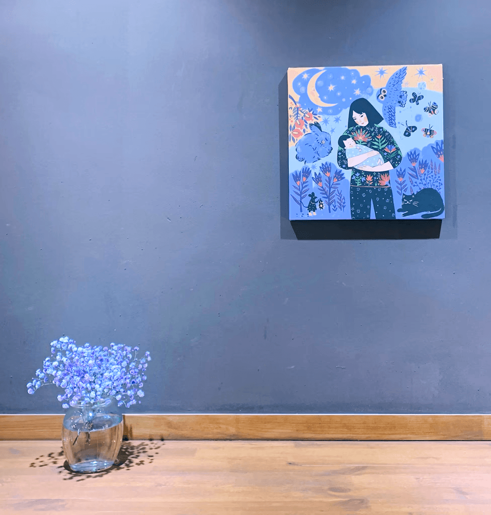 man carrying baby painting