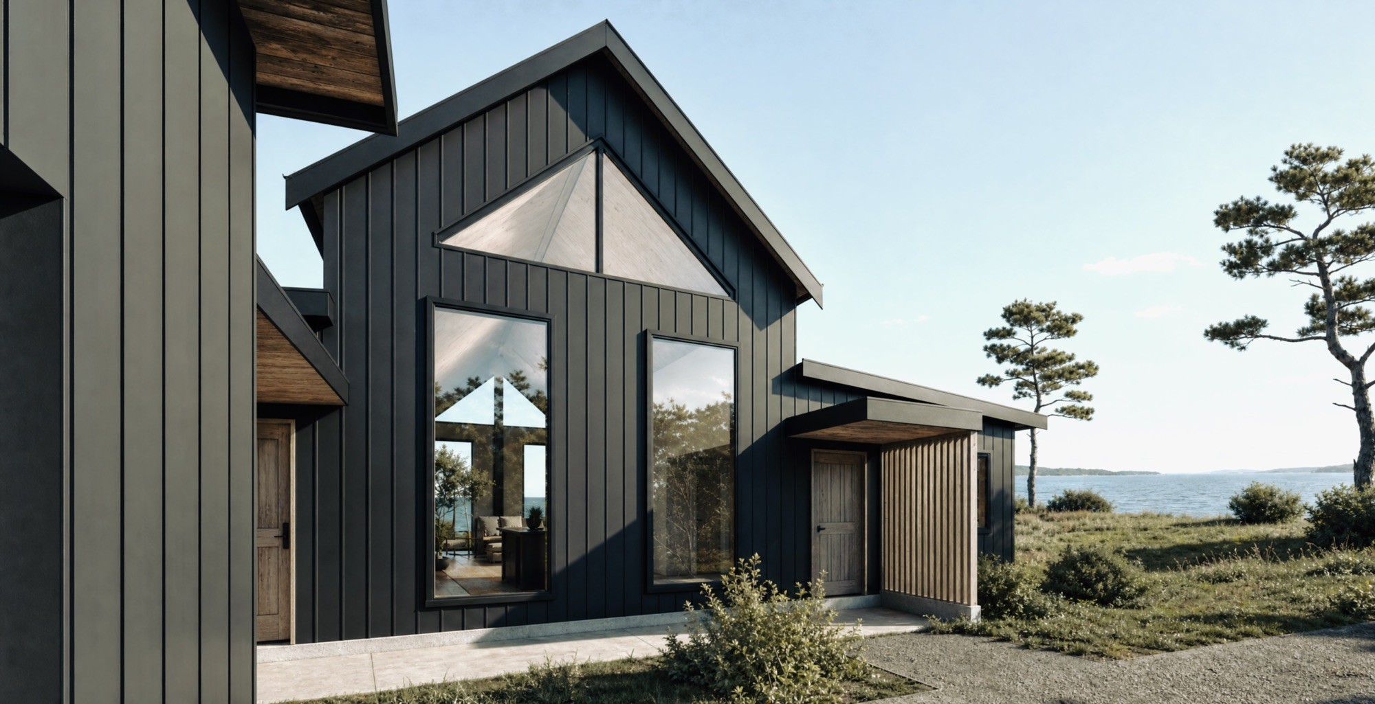 Front elevation of the Bogden Residence showing the gabled glazed entry and dark vertical cladding