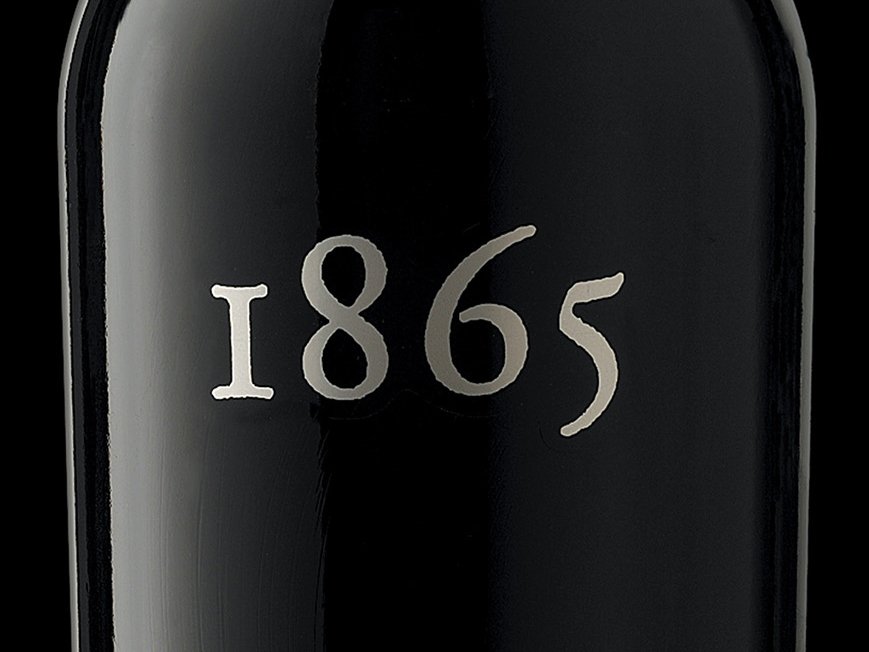 Rustic cabin in a golden field at sunset