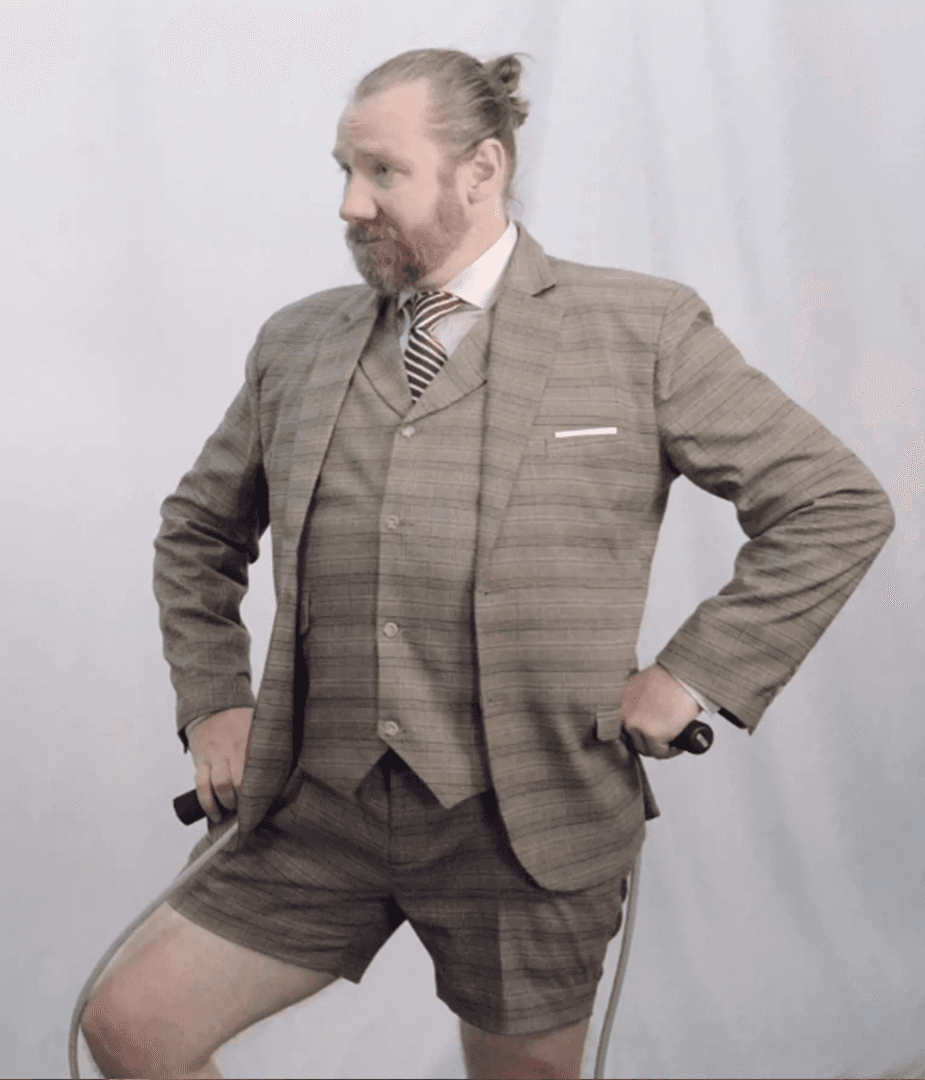 Man in plaid shorts suit holding jump rope, part of comedic Woot! pre-roll video series highlighting irreverent brand personality.