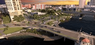 Waterfront park view of West Riverwalk Expansion showing riverside pathway and modern amenities