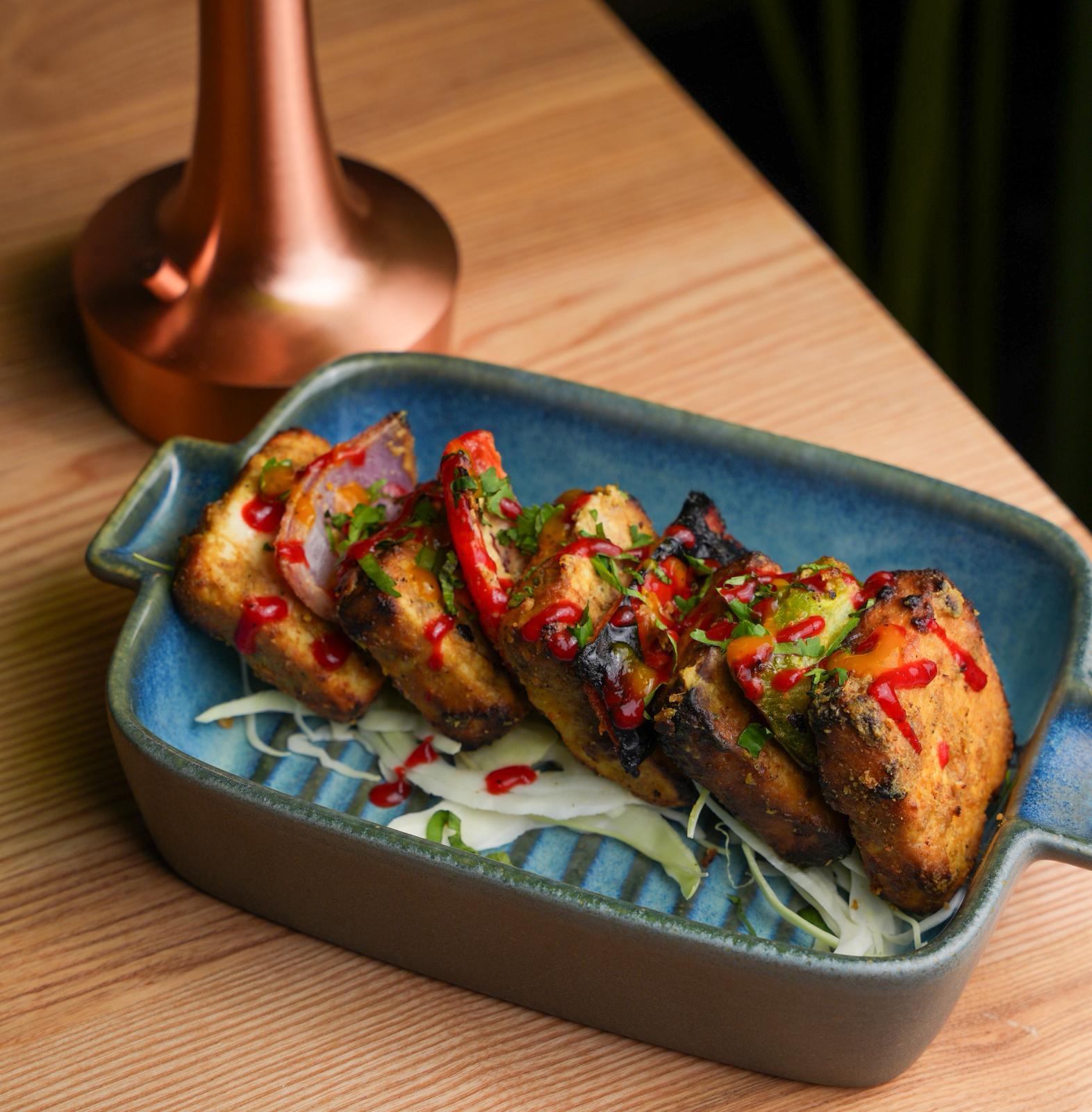 Assorted tandoori appetizers grilled to perfection at Dhoom Indian restaurant in Greektown Toronto