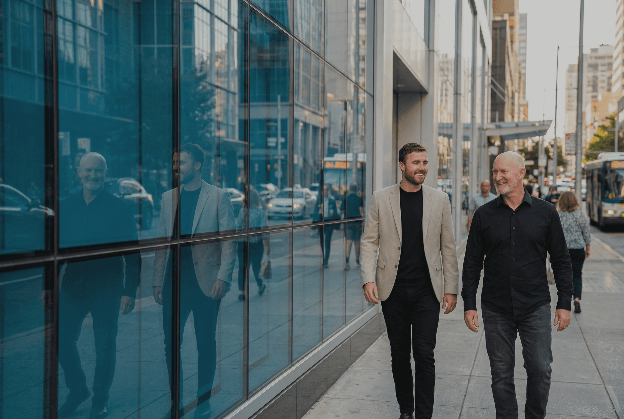 man wearing gray polo shirt beside dry-erase board