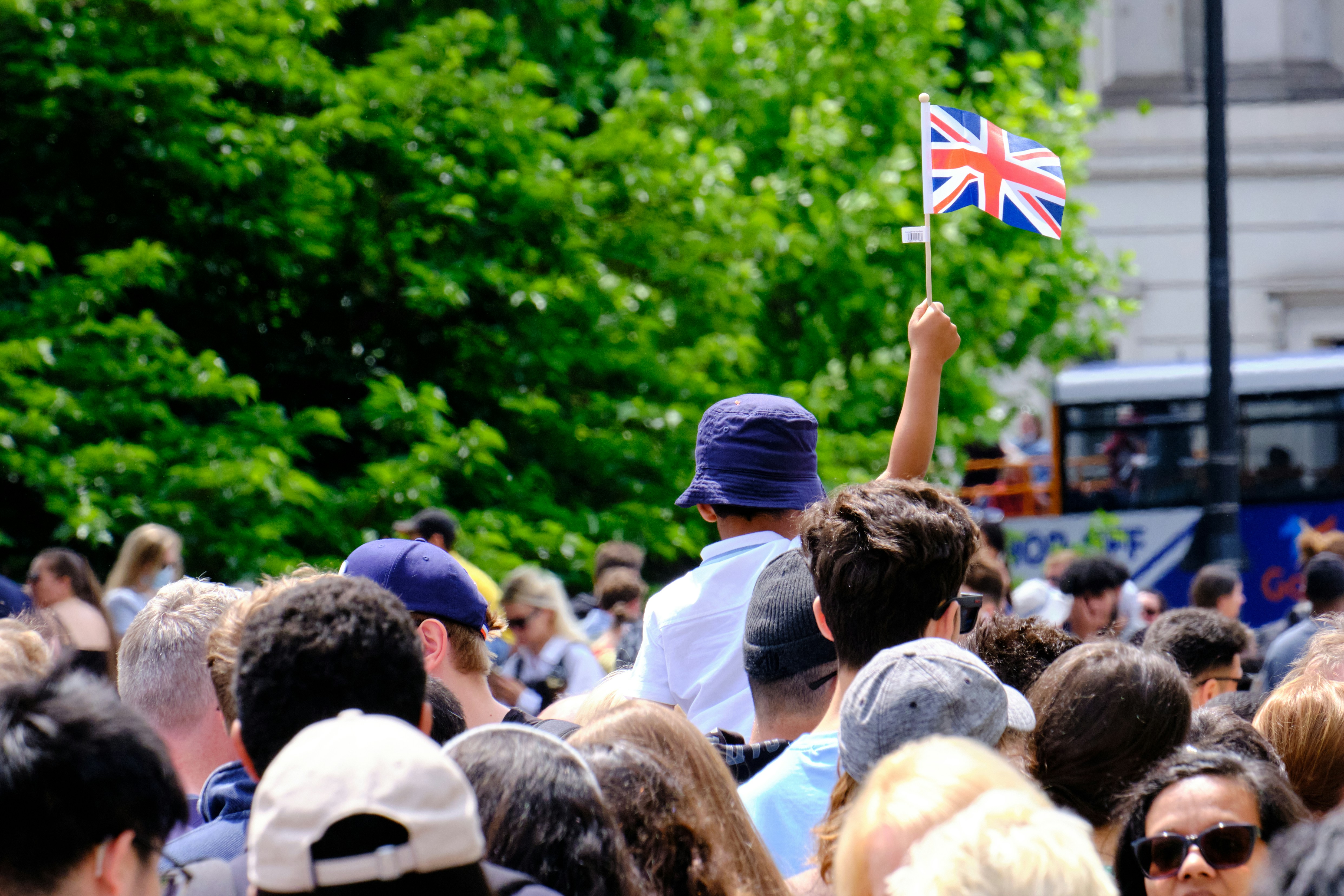 a group of children sitting on steps in front of a building