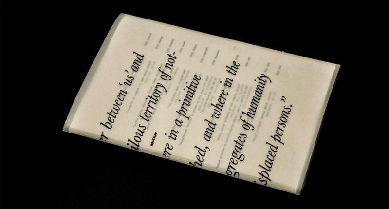 A semi transparent imprinted and folded paper with some text on it.