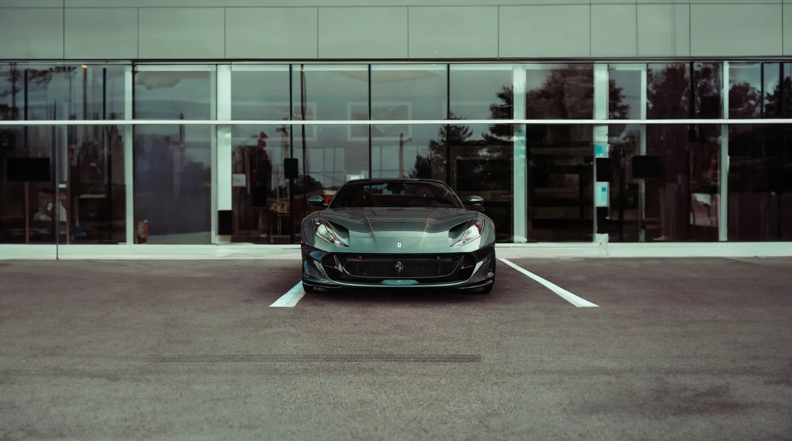 a black sports car parked in a parking lot