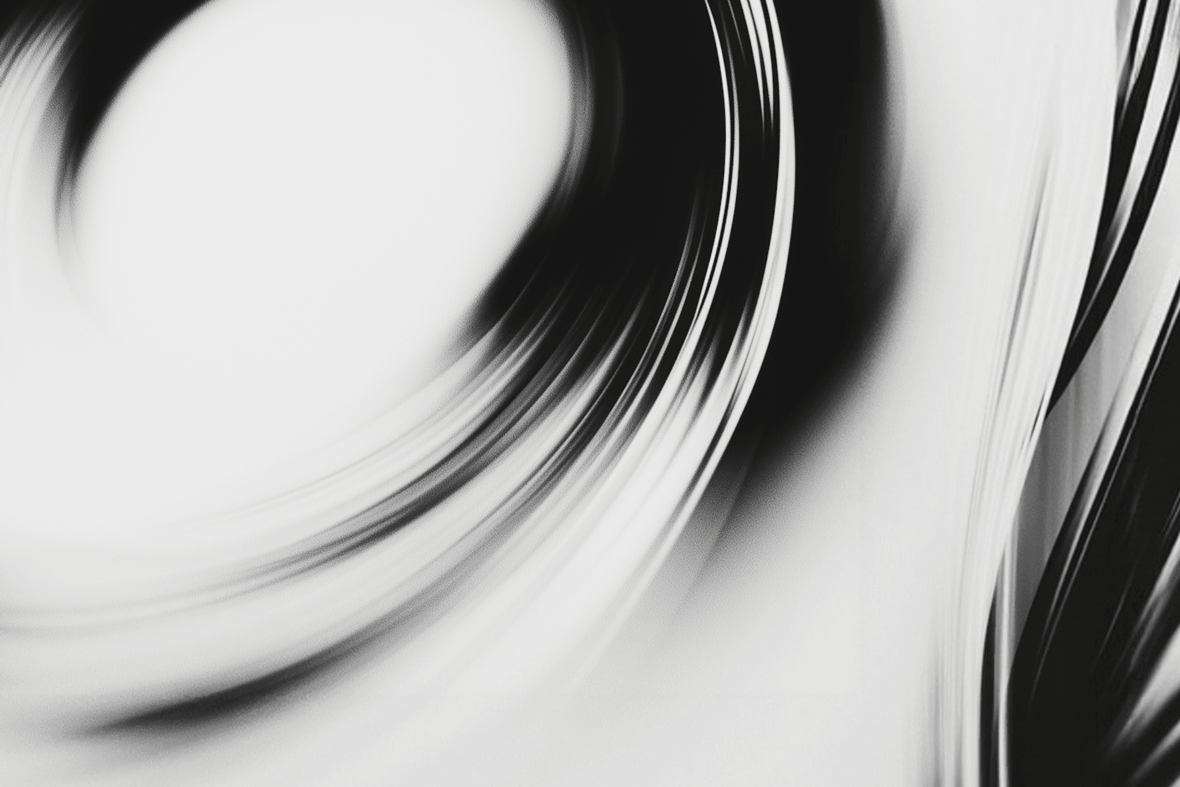 Abstract black and white swirl design with dynamic curves and a vortex-like motion, creating a modern and minimalist aesthetic.