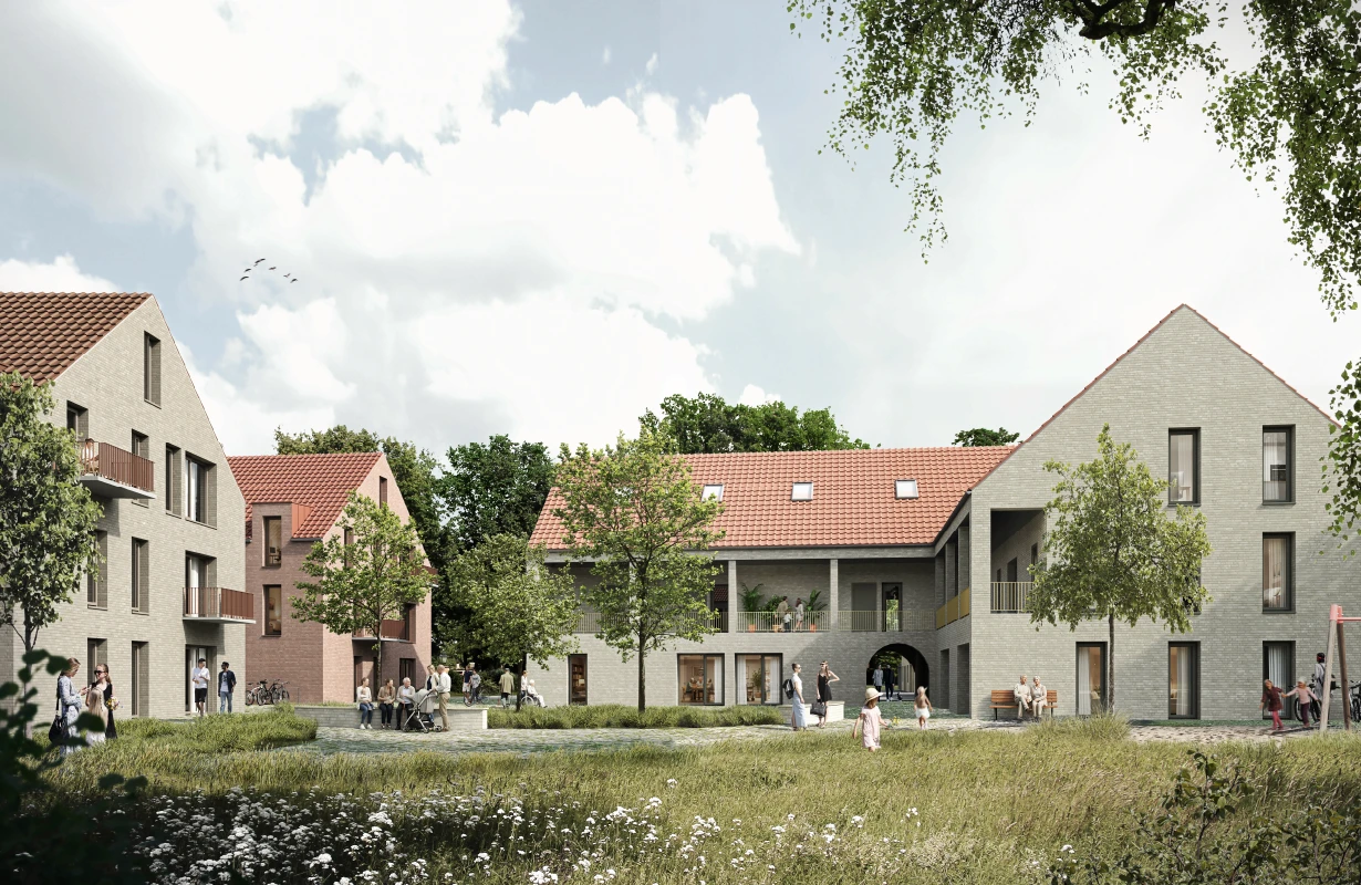 Zweigeschossiges Wohngebäude mit Klinkerfassade, großen Fenstern und Balkonen vor blauem Himmel