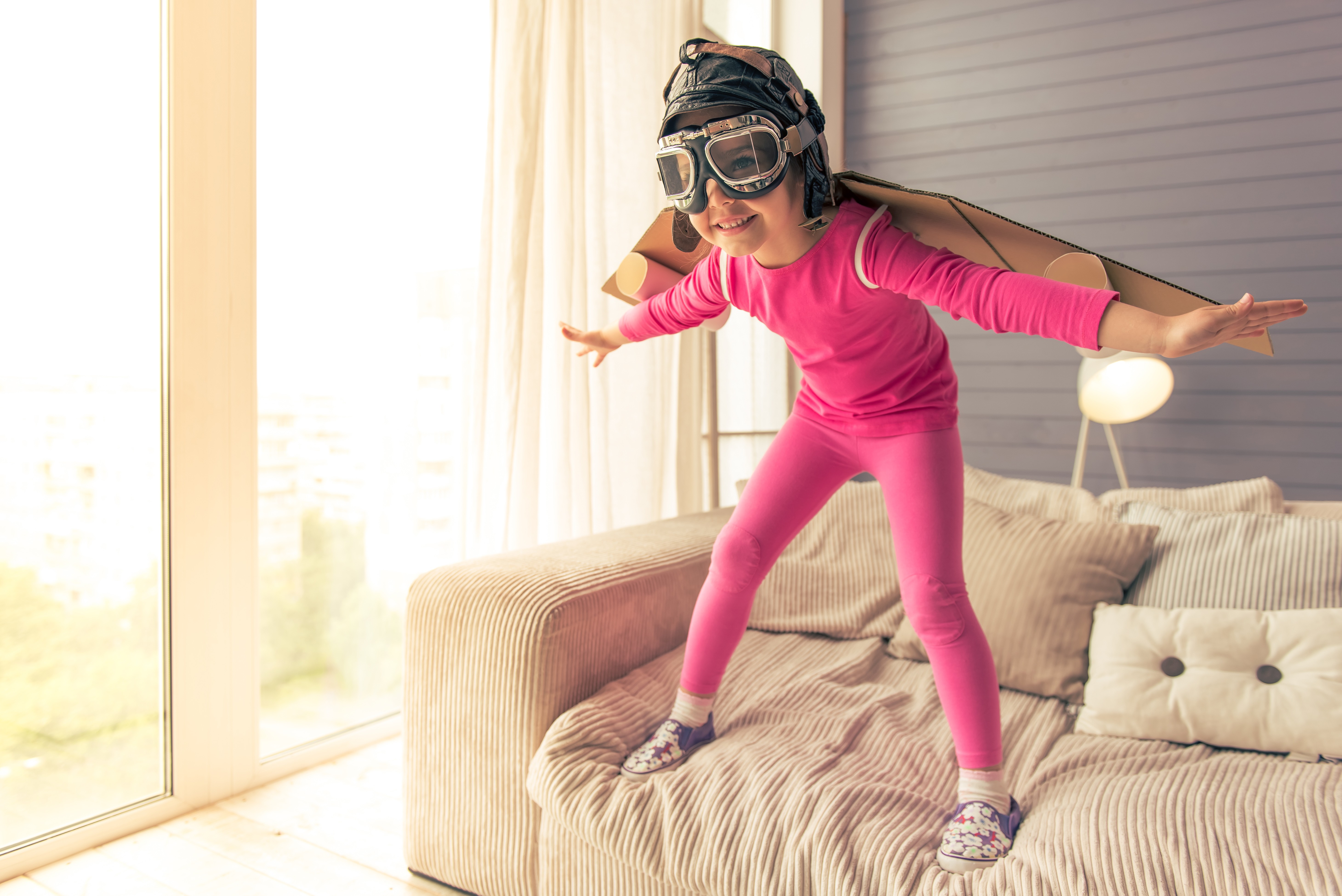 girl palying on sofa