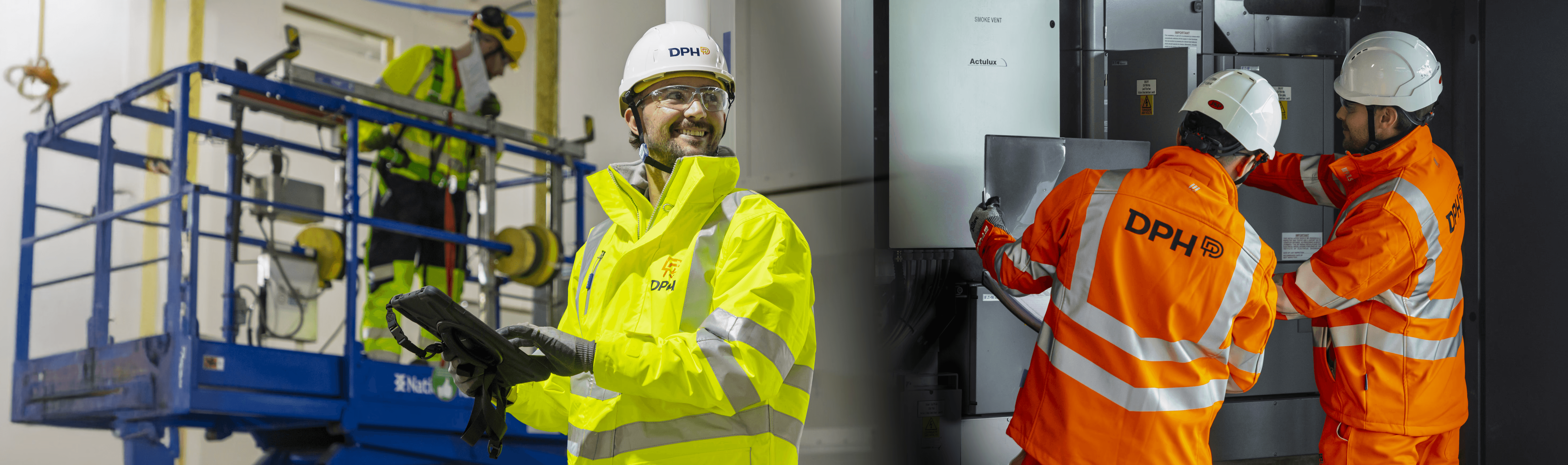 Modern glass building with illuminated facade and cityscape view at sunset
