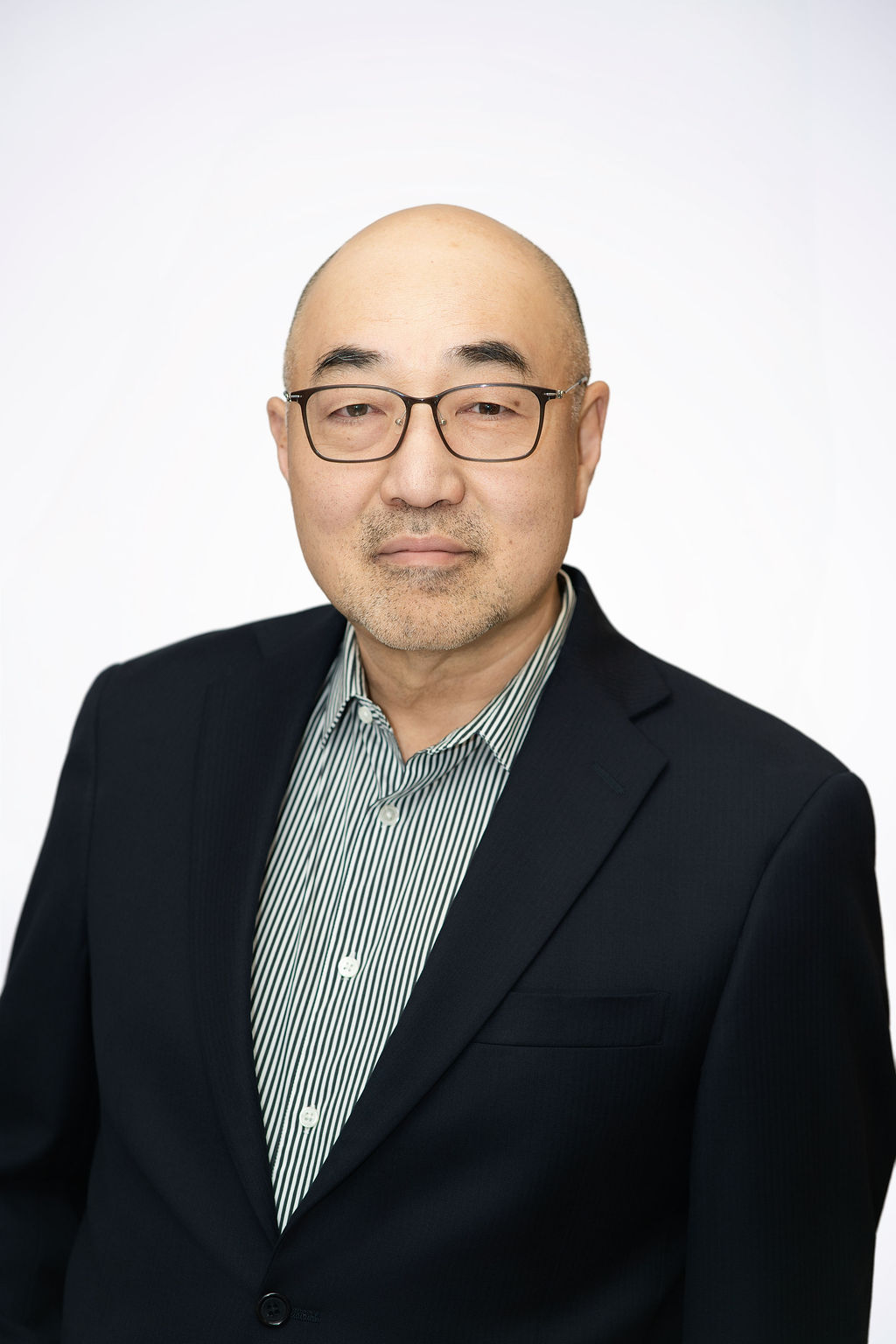 Scientist looking through a microscope in a lab.