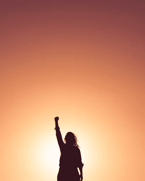 A woman receives a relaxing energy healing in a serene setting with soft lighting.