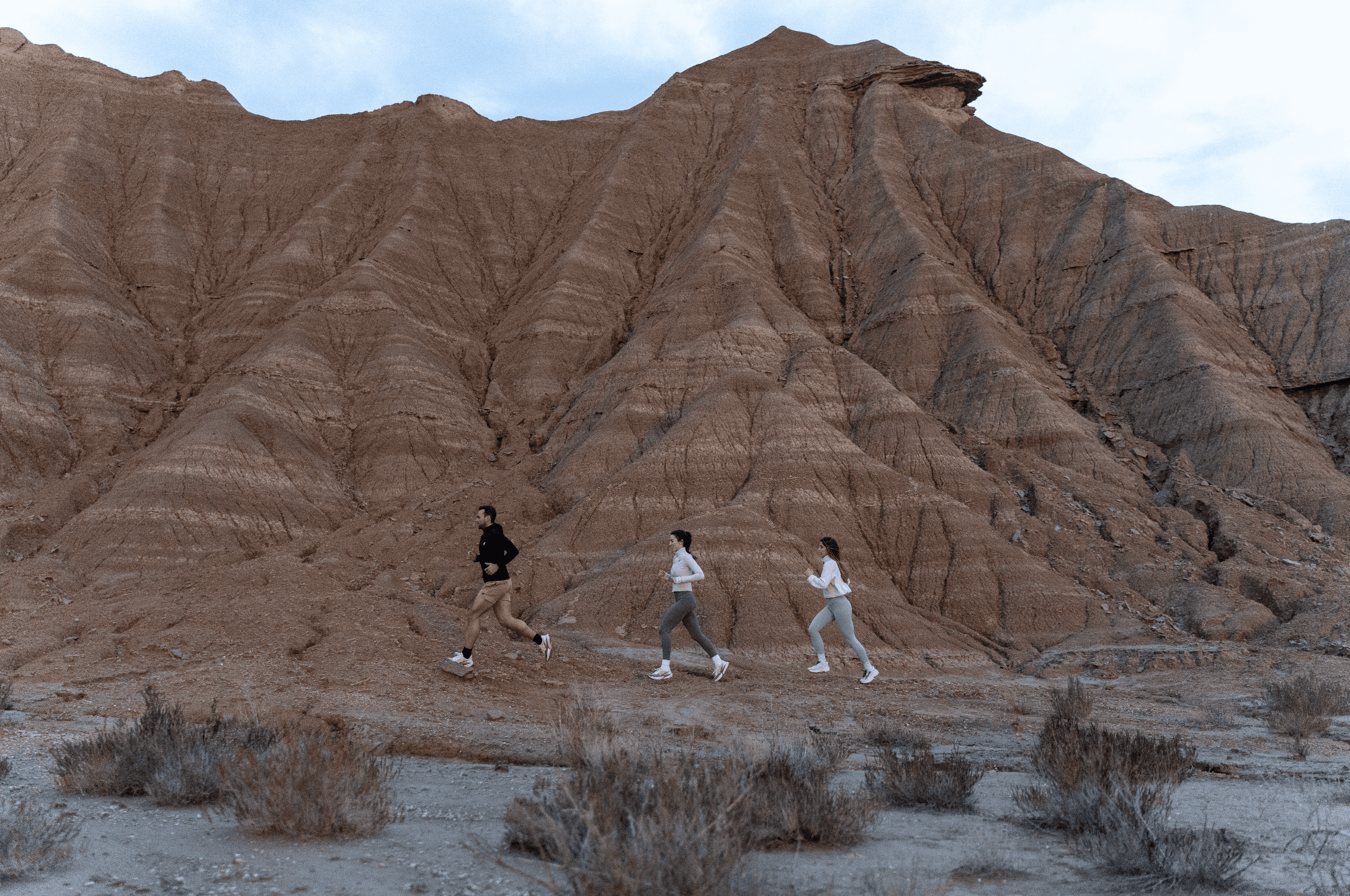 Woman in a dark golf outfit mid-swing on a lush green golf course, with sand bunkers and trees in the background, promoting a 38% discount.