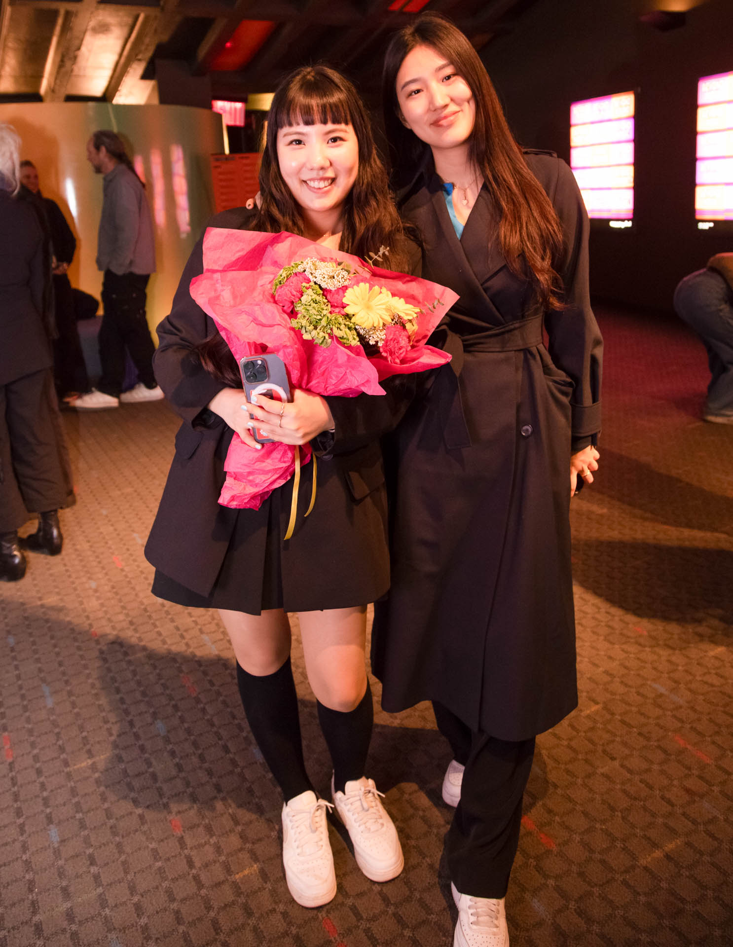 a group of students smiling for the camera in the SVA Theatre lobby after the Venture Forum