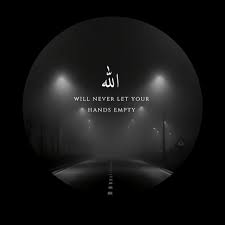 A professional portrait of a man in a gray blazer and white shirt