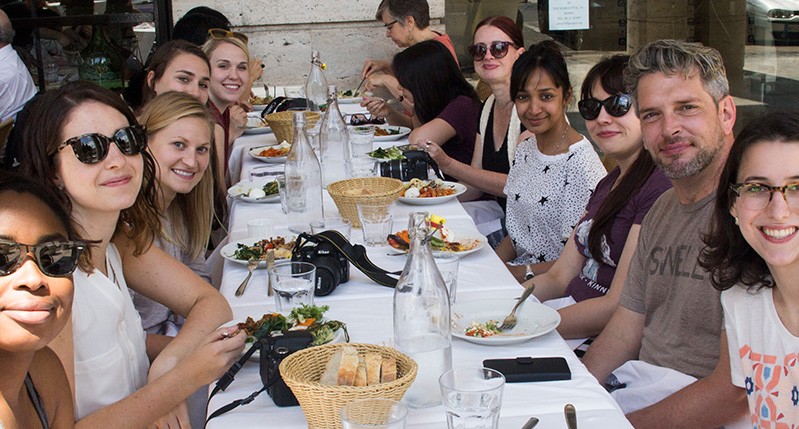 group of people having lunch at the table
