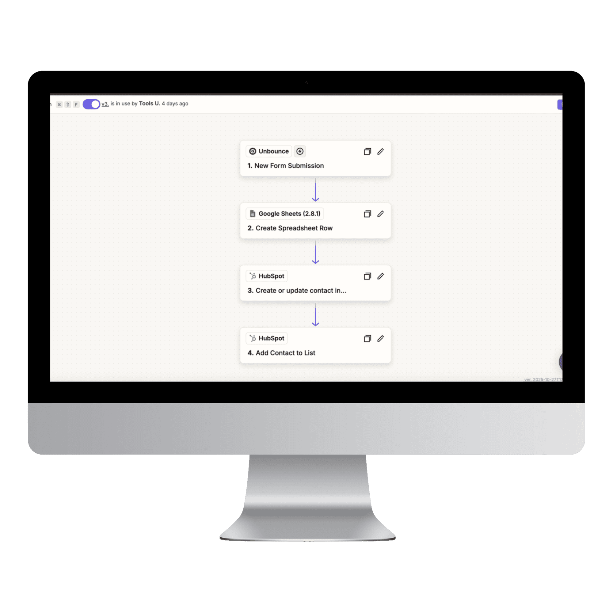 man working at a computer, slightly obscured by flowers