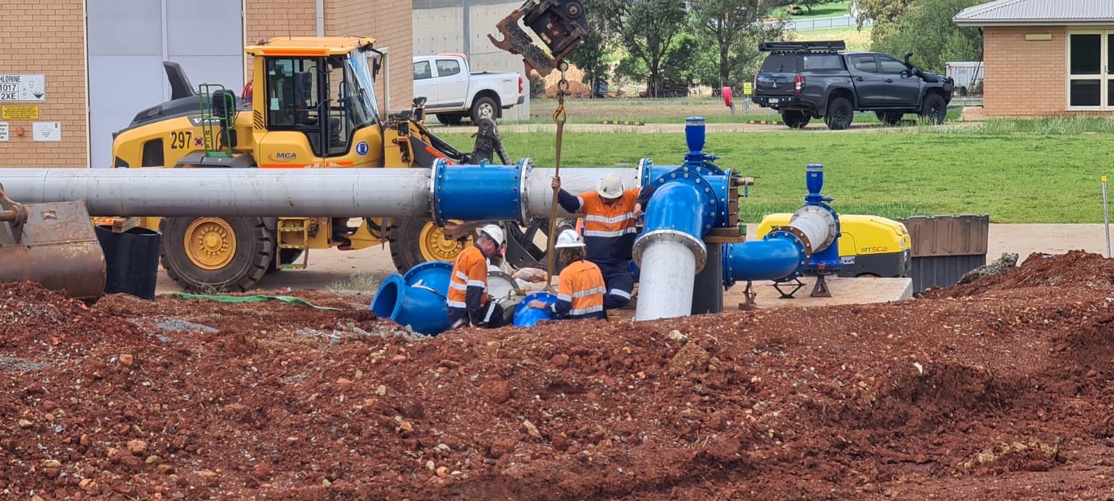 Construction crew installing large-diameter water pipeline as part of a major regional water infrastructure upgrade, overseen by UMINEX for Parkes Shire Council