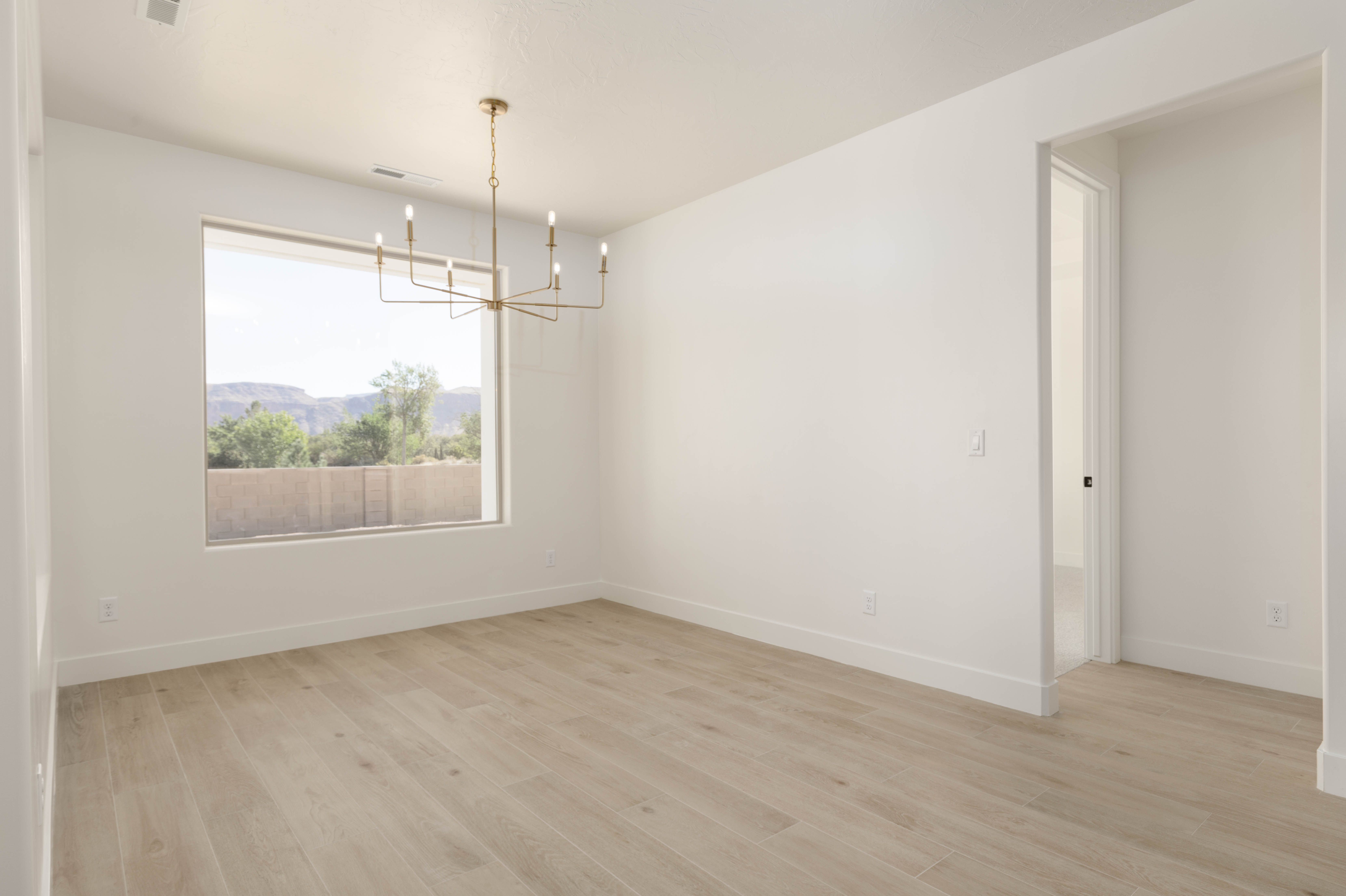 Bright dining area in The Meridian home with open layout and modern design in Hurricane Utah.