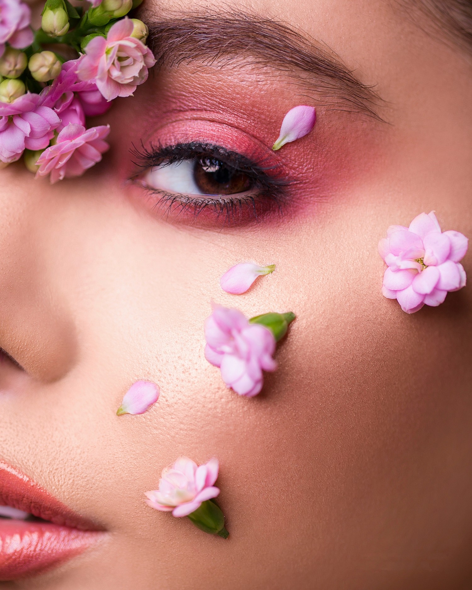 closeup eye makeup model with flowers