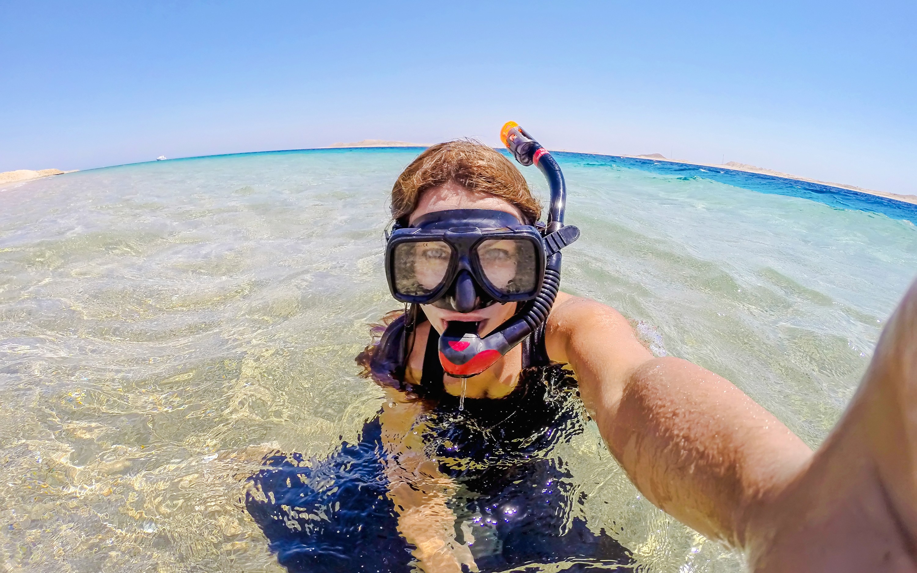 Woman snorkeling in clear waters at Ras Muhammad National Park, Egypt.