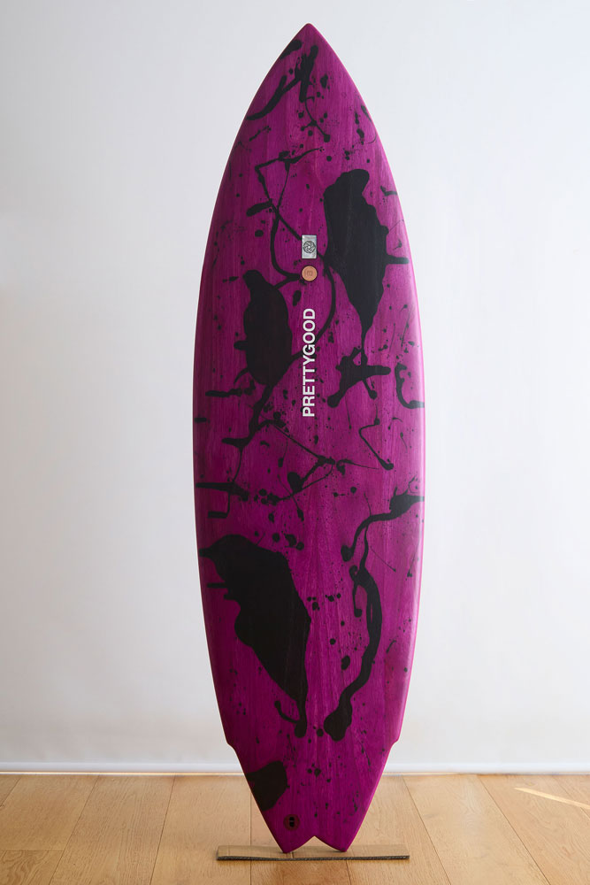 Purple and black wooden surfboard deck