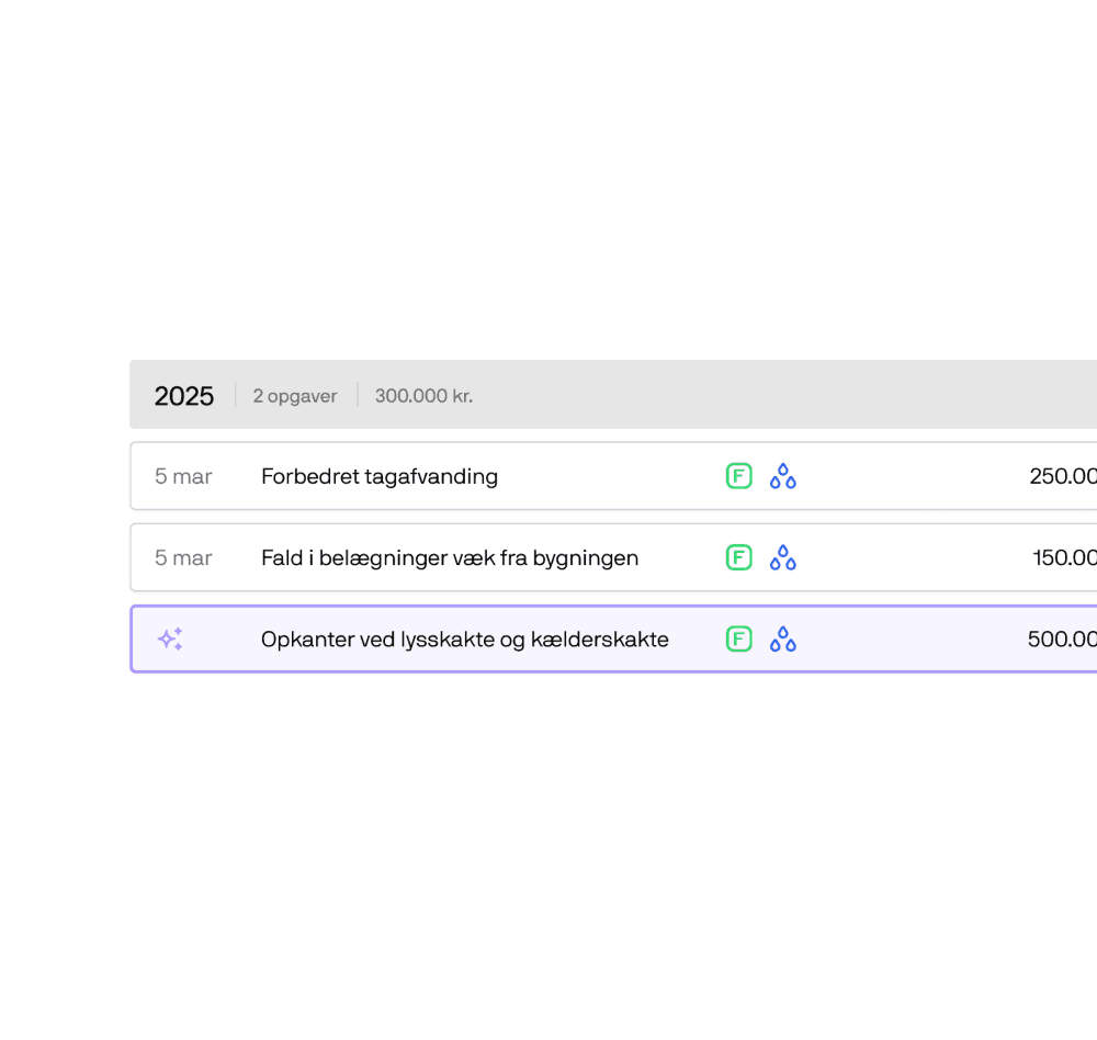 two ladies looking at a laptop and smiling