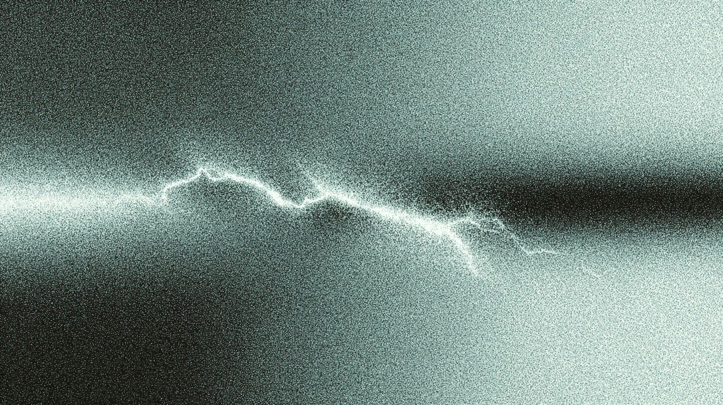 Abstract monochrome image with heavy grain and a jagged glowing line running horizontally across the center, resembling an electrical waveform or lightning in static.