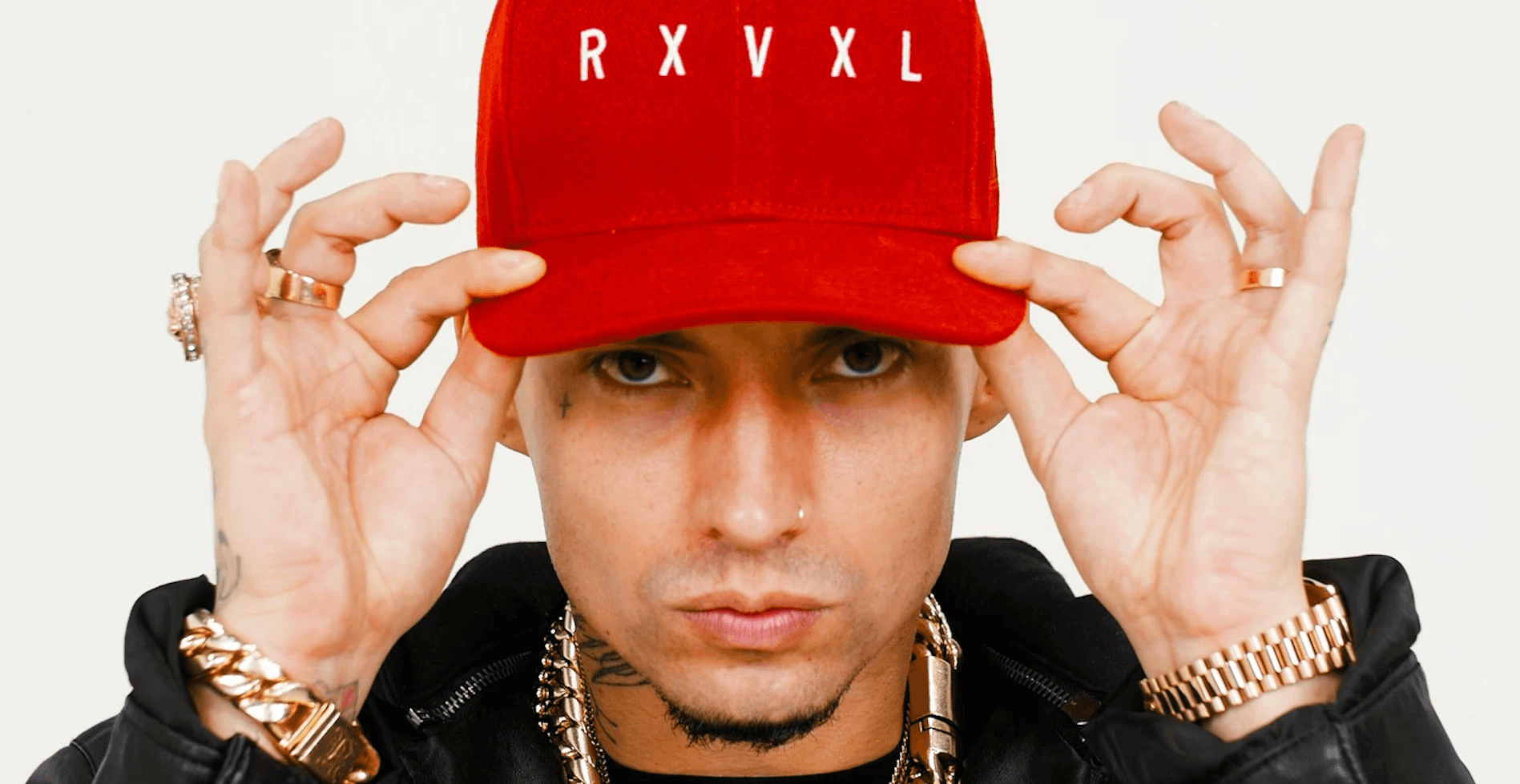 Cinematic music video frame of Filipe Ret featuring a close up portrait