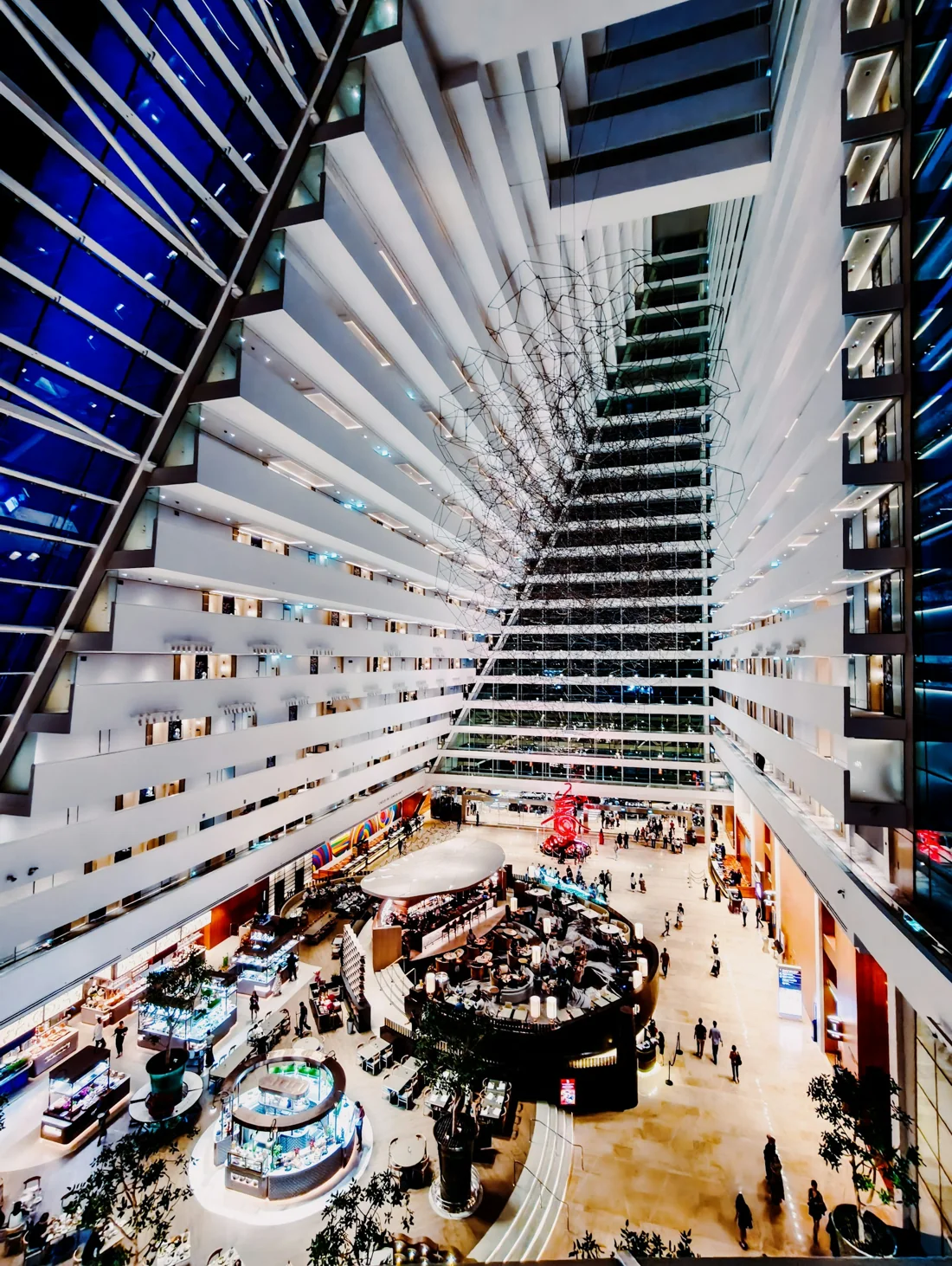 Looking down the atrium to the lobby floor and its suspended wire sculpture