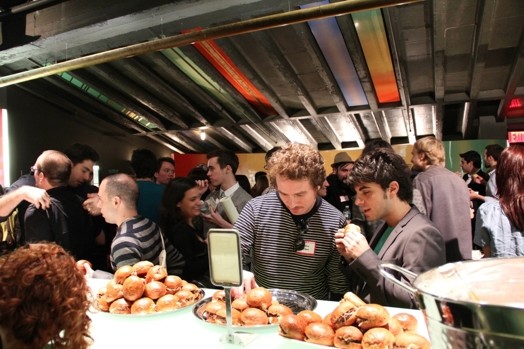 people looking at the food from a table