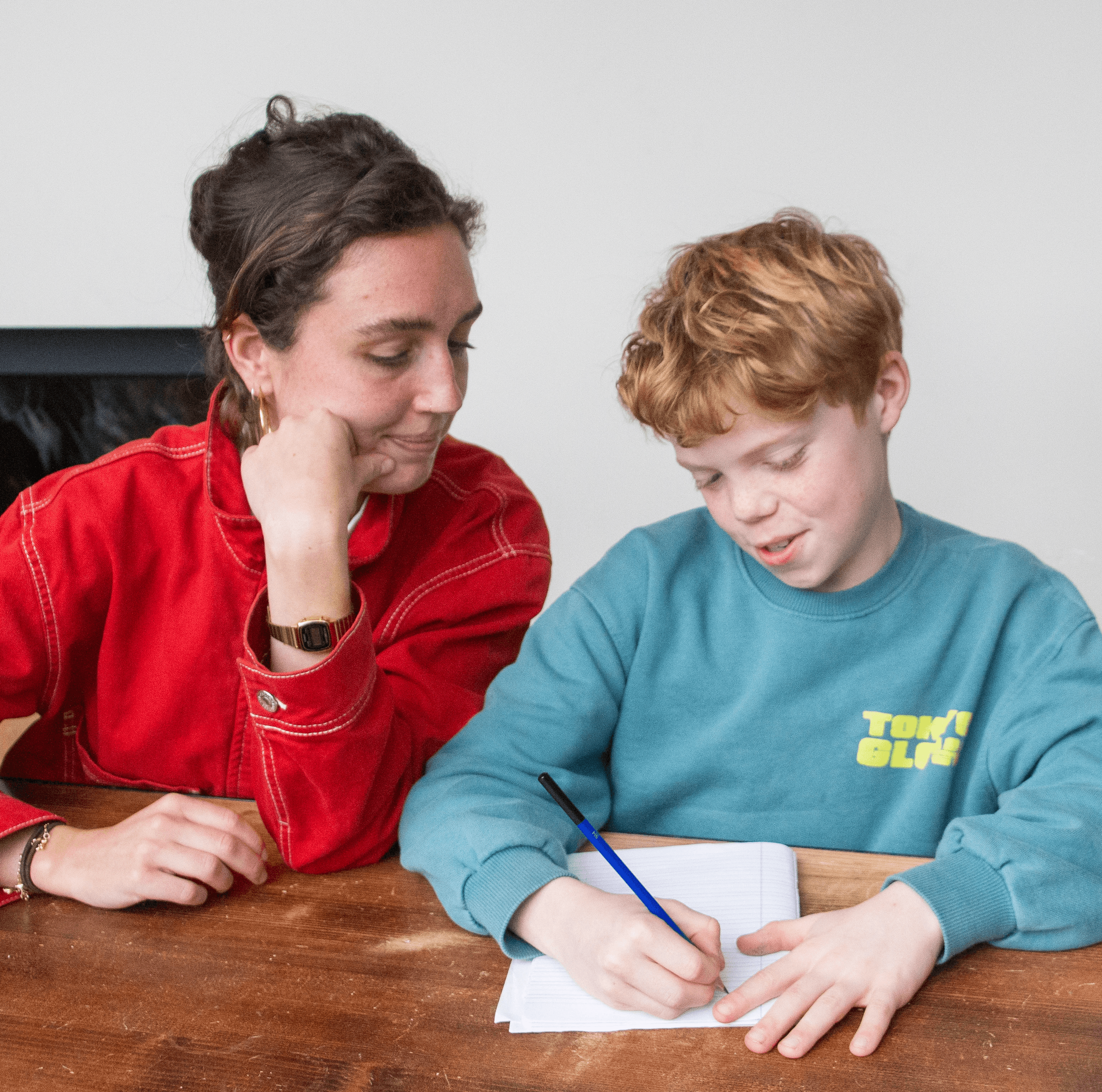 Babysitter Saar helps with homework while babysitting