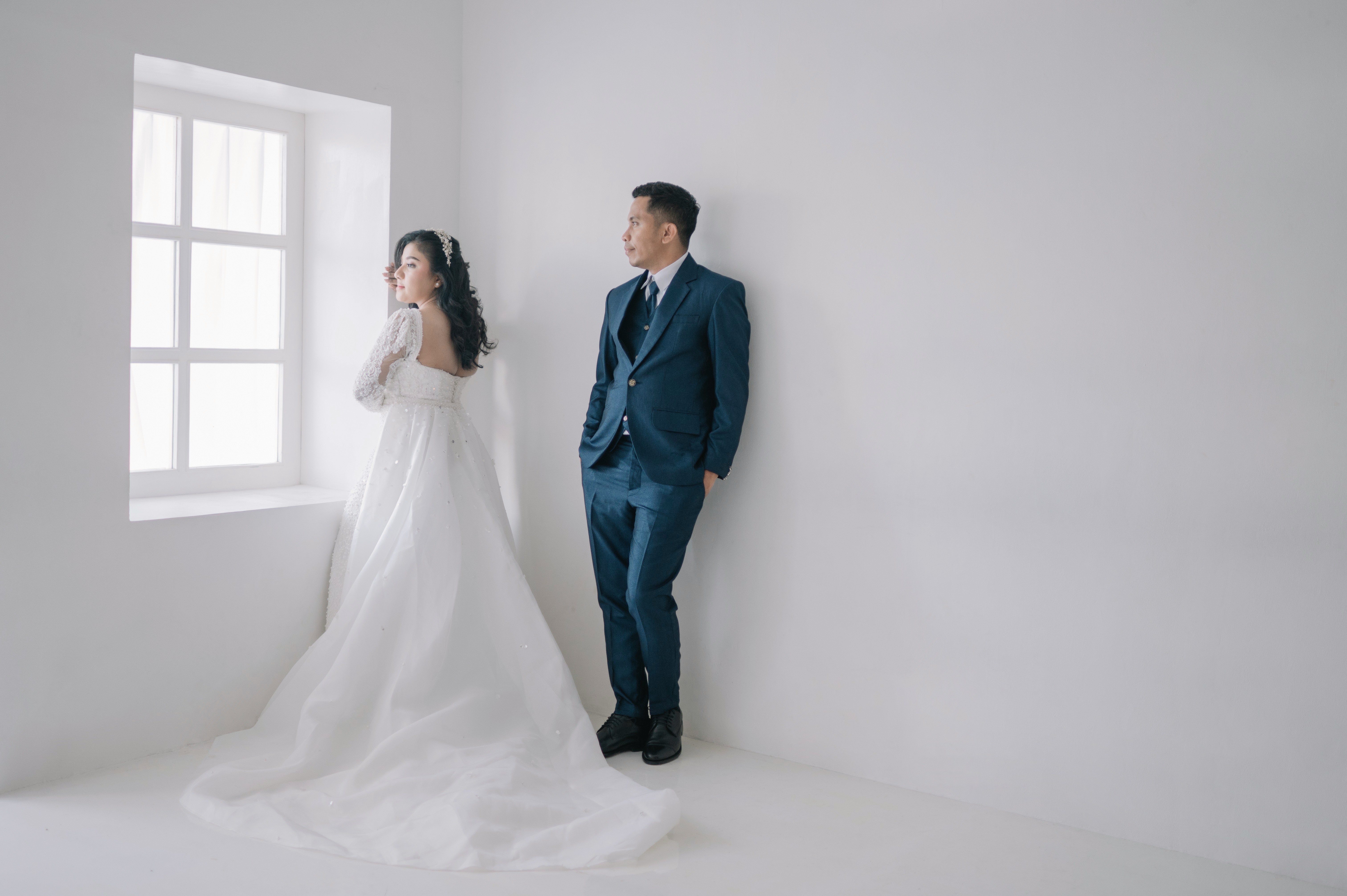 a man and woman in wedding attire