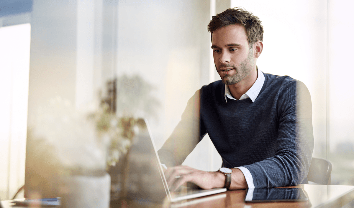 consultative selling: man using a laptop