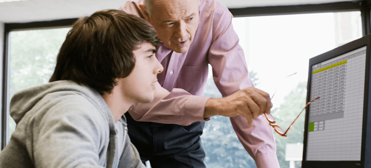 Two people reviewing data on screen - How to Do Conditional Formatting in Google Sheets