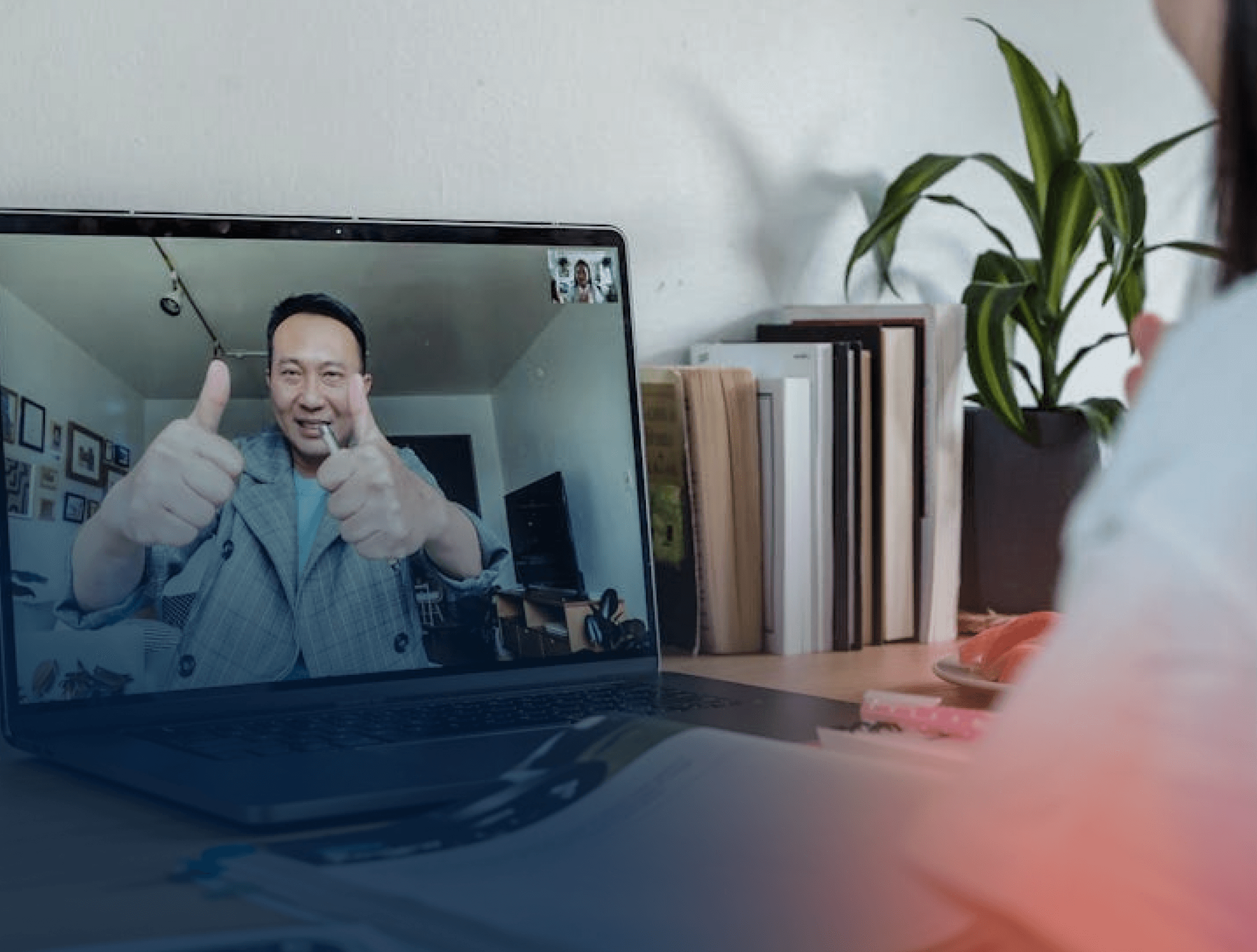 Laptop with image of man doing double thumbs up