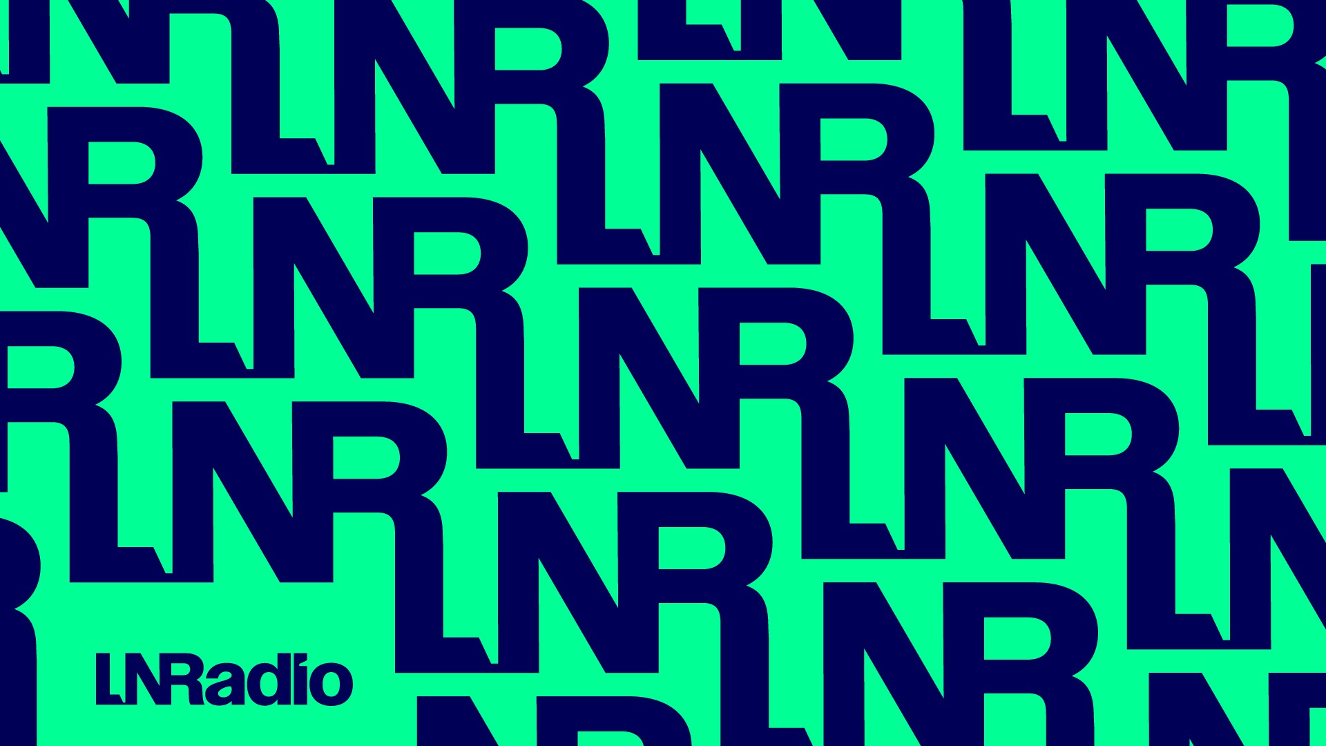 Modern home office setup with a monitor, ergonomic chair, keyboard, and indoor plants near a window with blinds.