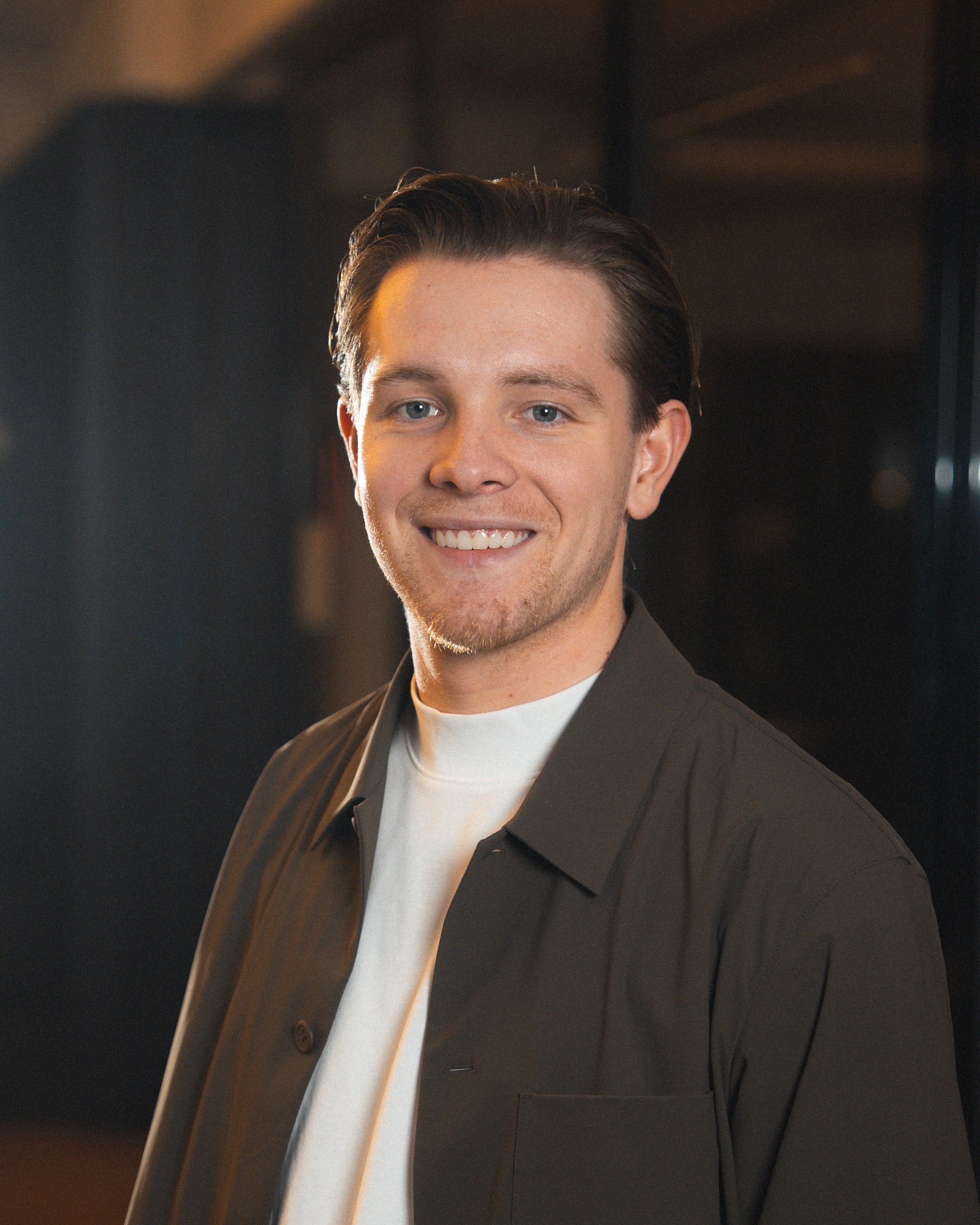 Profile portrait of a man in a grey shirt