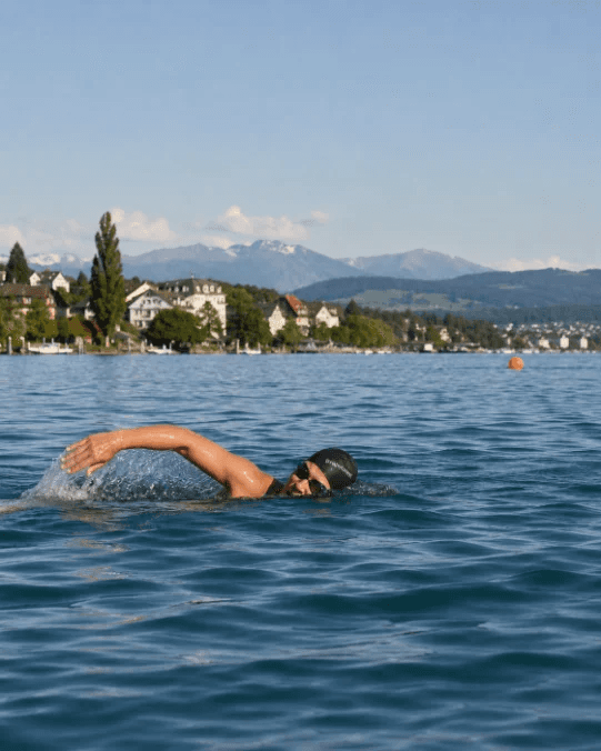 Open-water swimmer in an alpine lake.