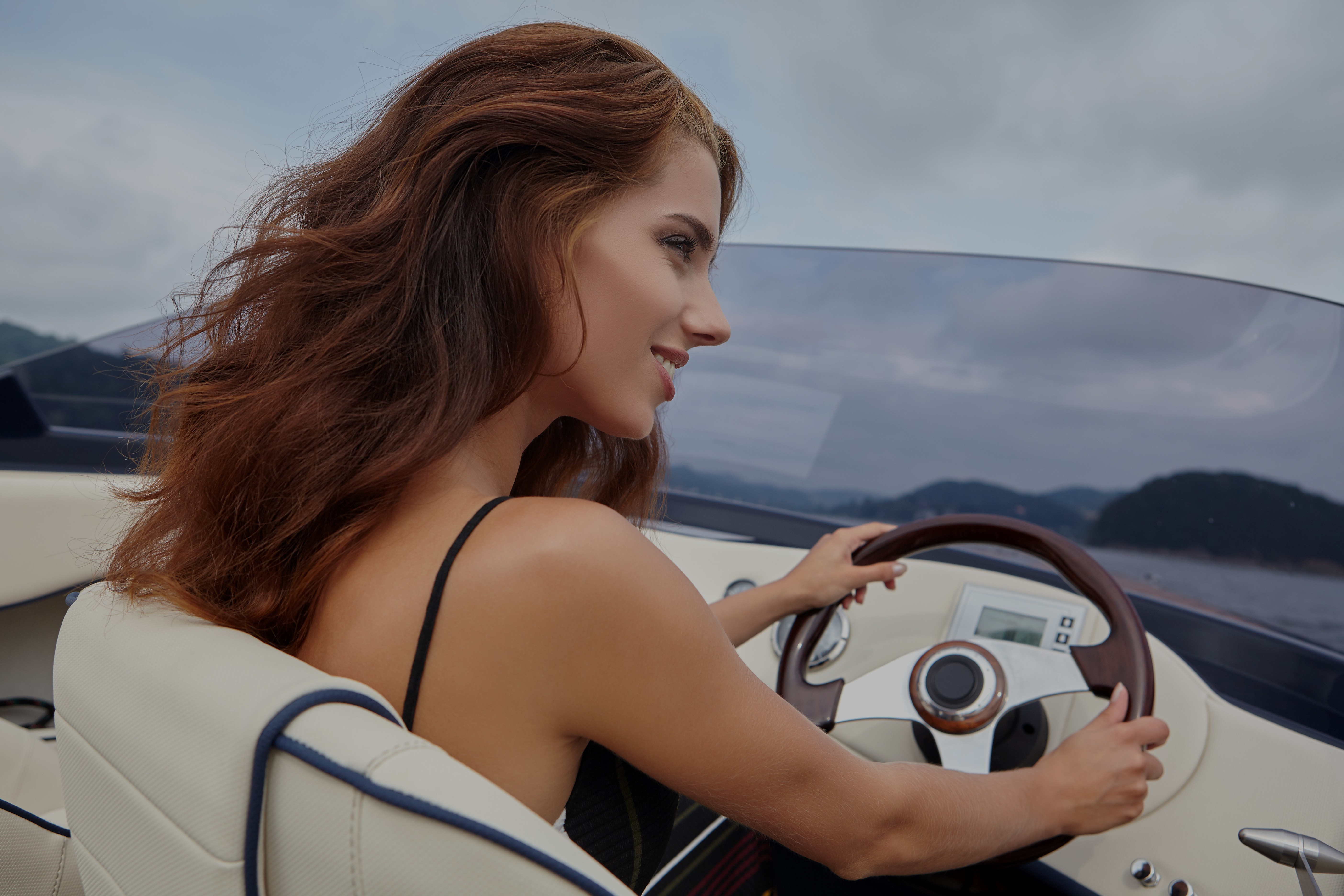 woman driving a boat