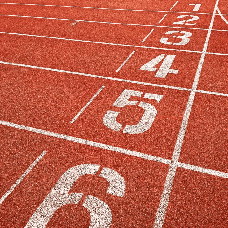 Lane markings on a running track showing numbered lanes used in indoor track design and competition standards