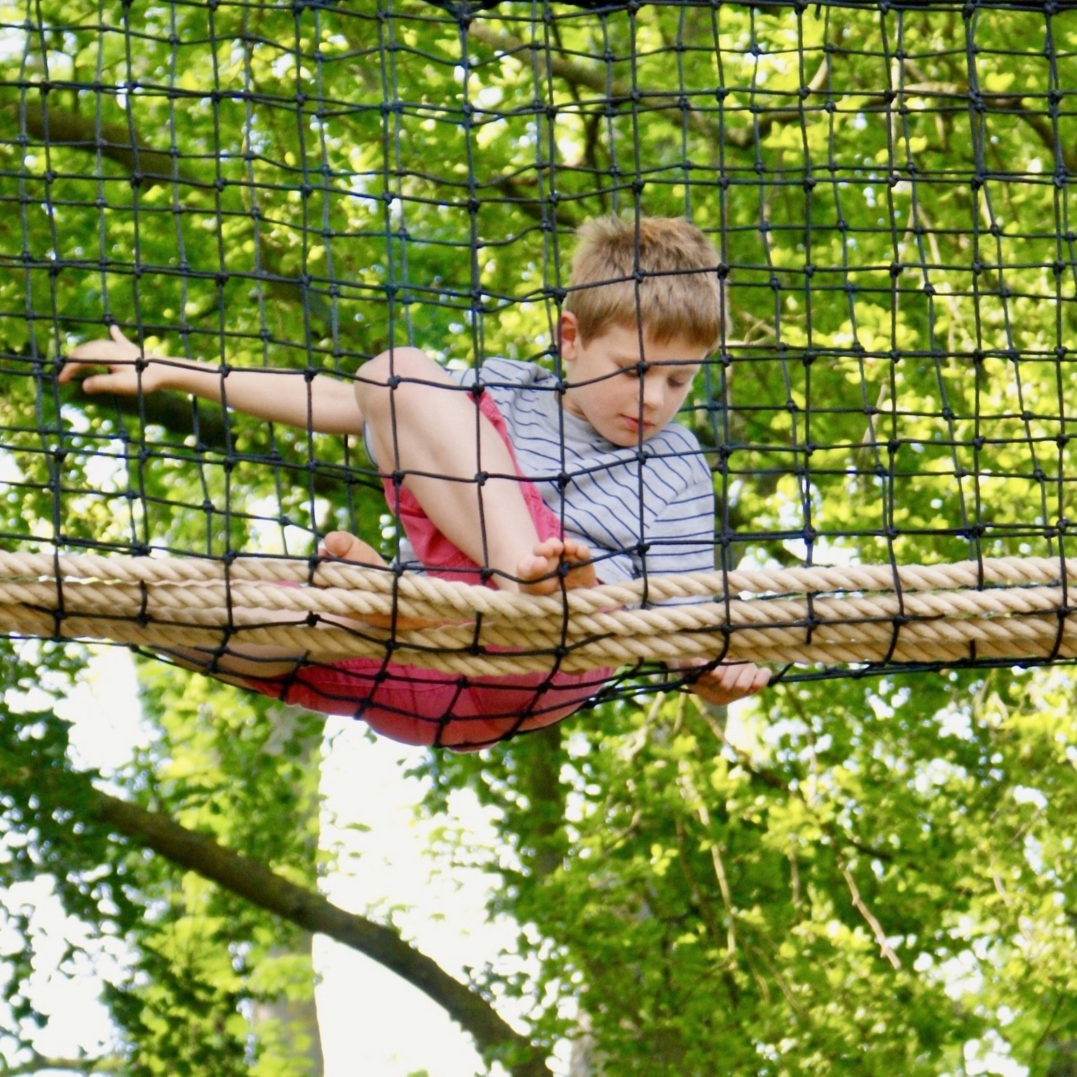 Streetside billboard with flyposters of the Batch.Works brand and illustrations