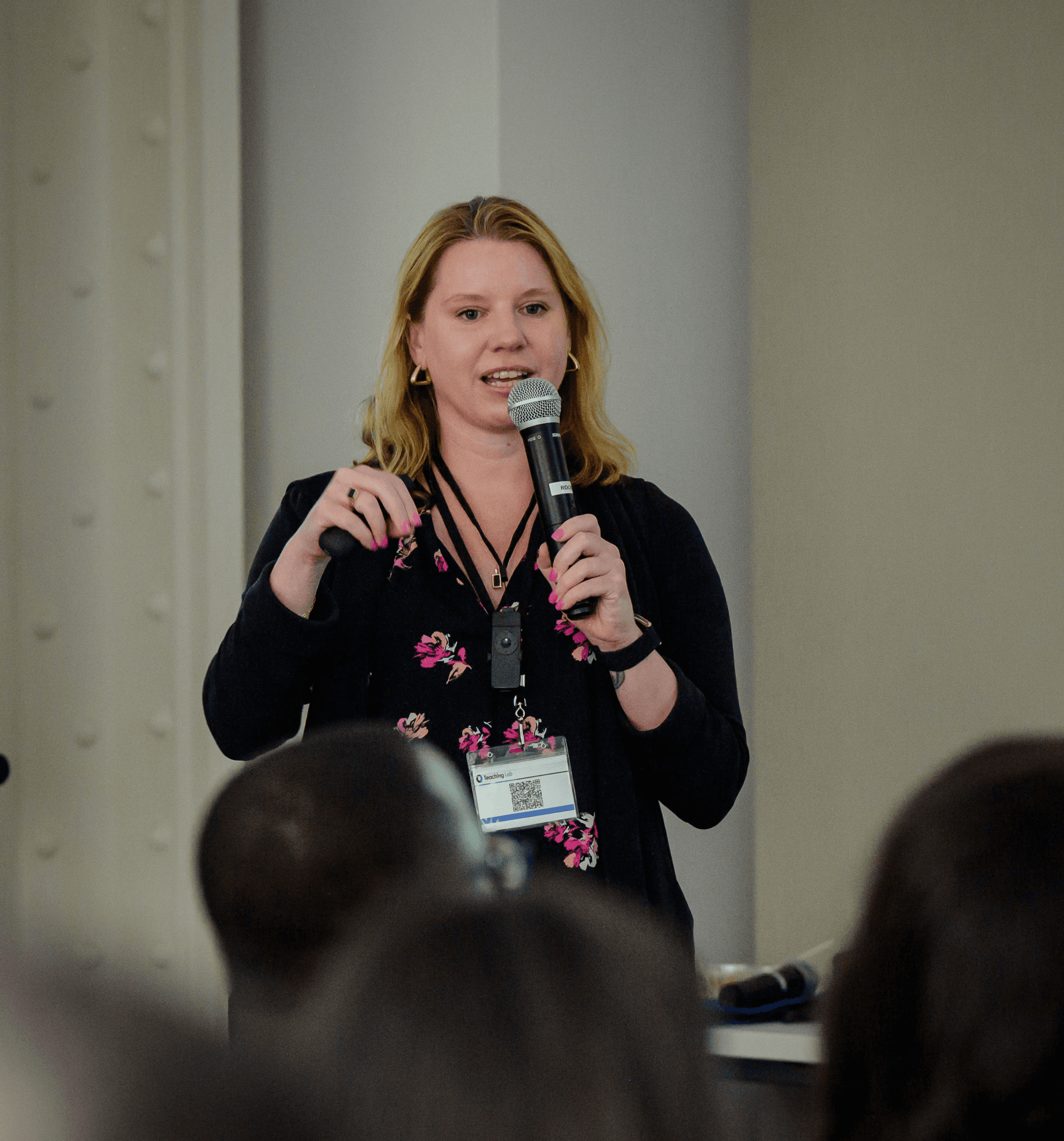 Photo of CEO speaking in front of crowd.