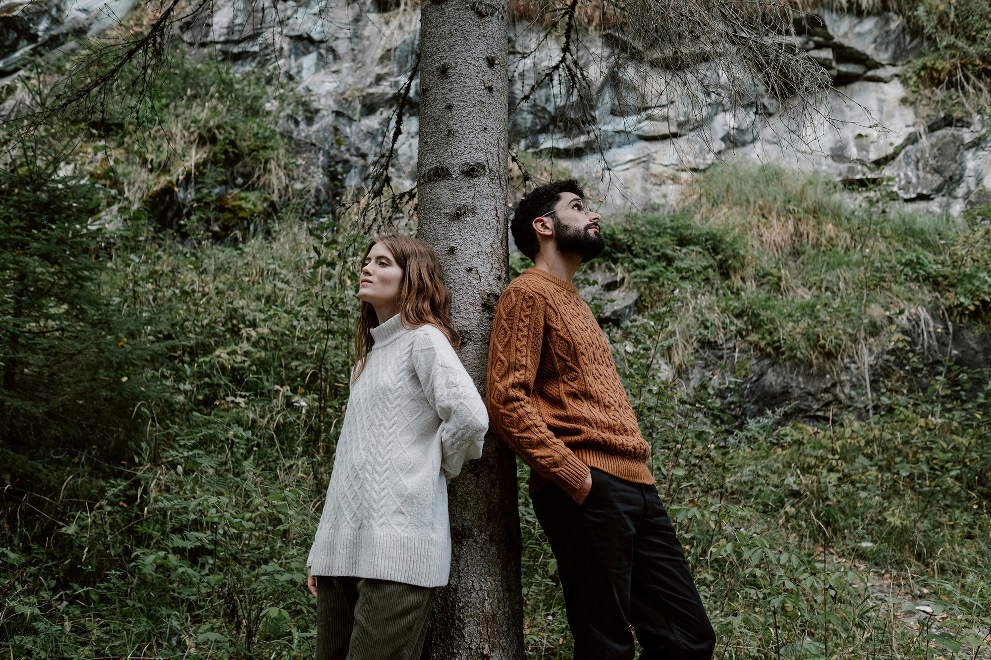 A couple standing near a tree